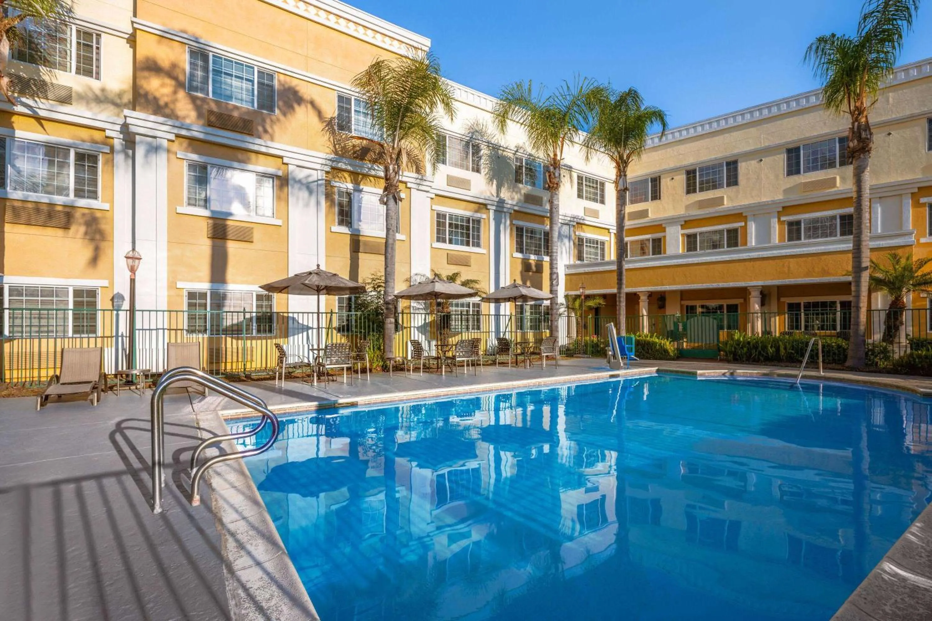 Pool view in Hotel Marguerite South Anaheim - Garden Grove, Trademark Collection by Wyndham