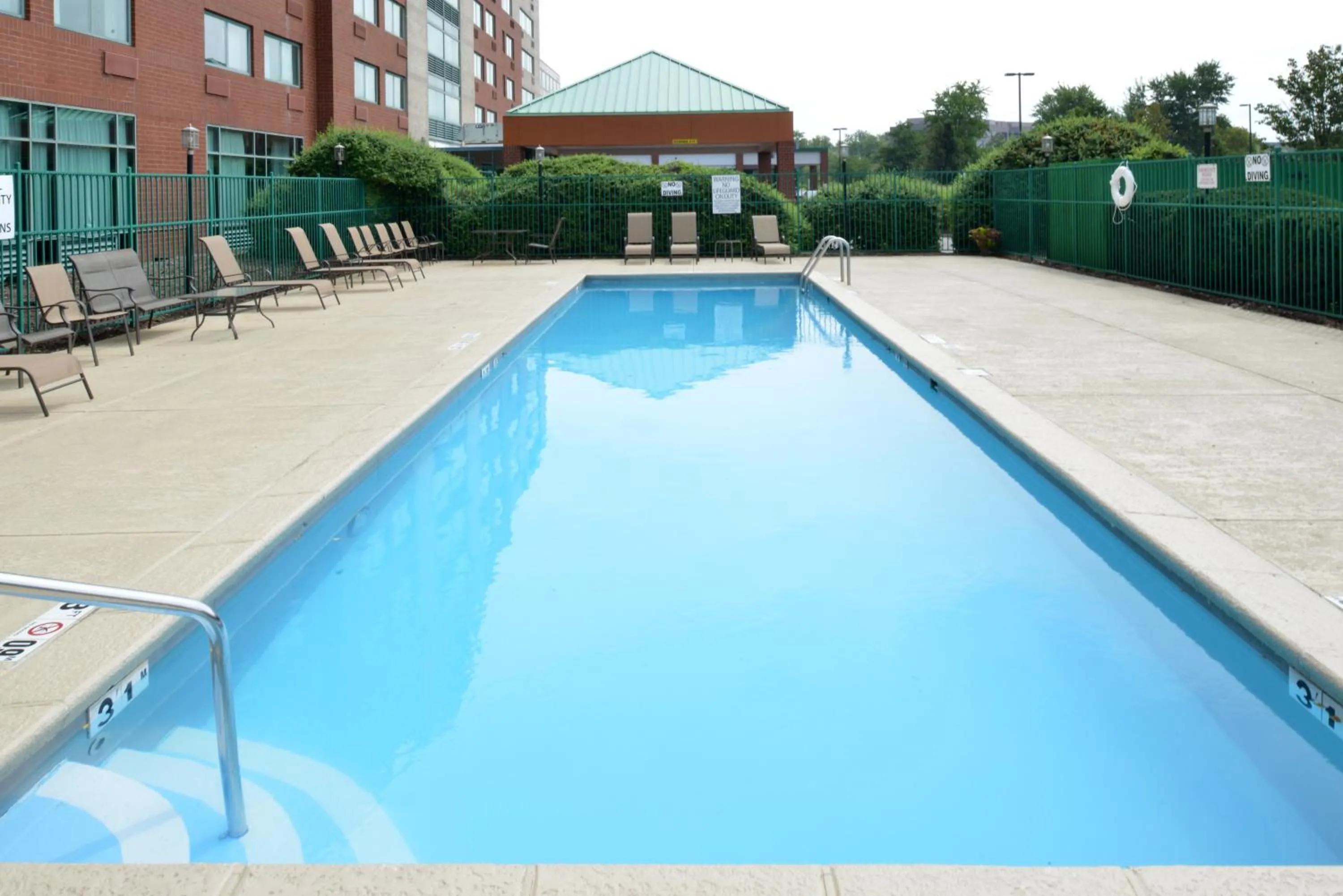 Swimming pool in Elimwood Hotel, a Ramada by Wyndham