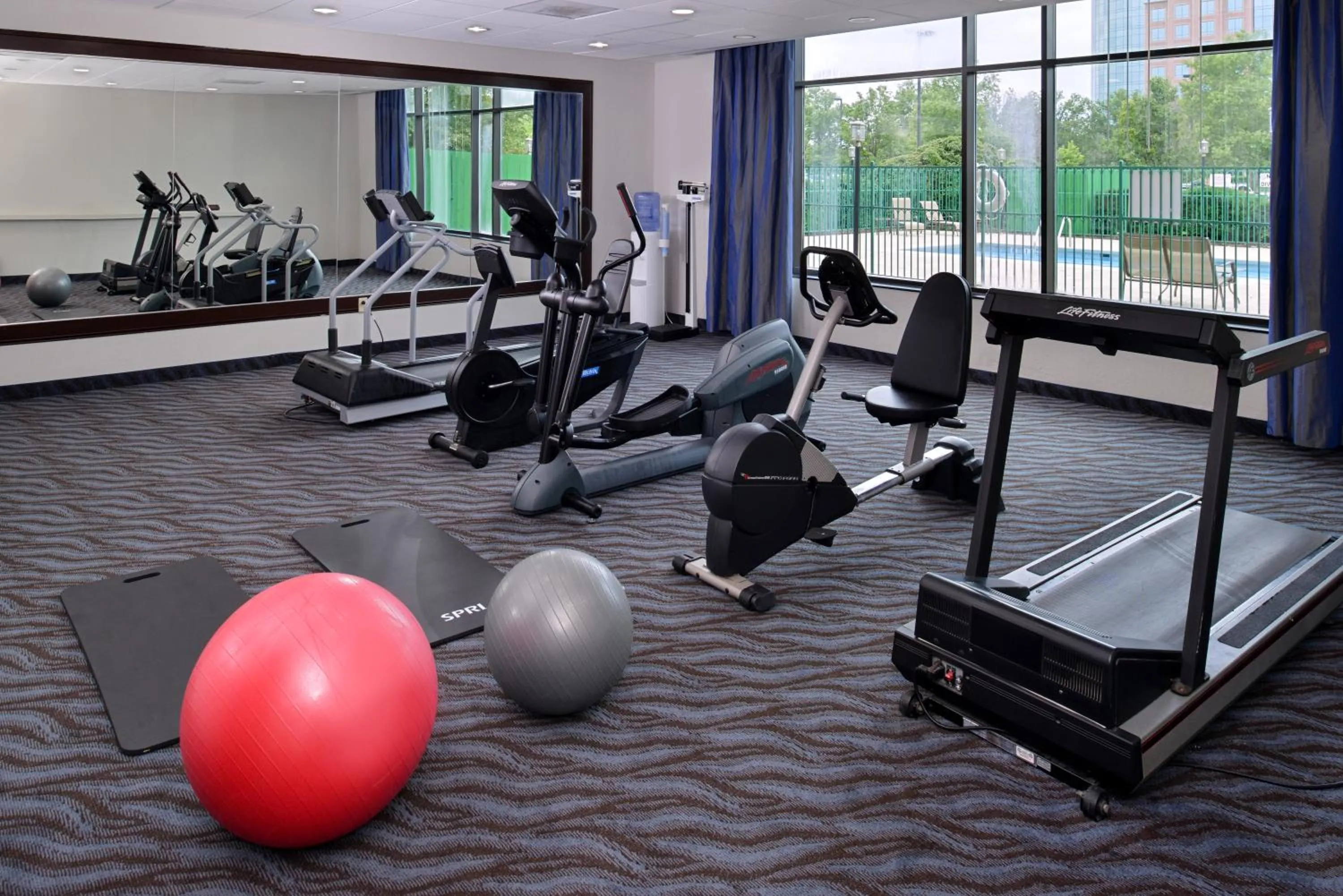 Fitness centre/facilities in Elimwood Hotel, a Ramada by Wyndham