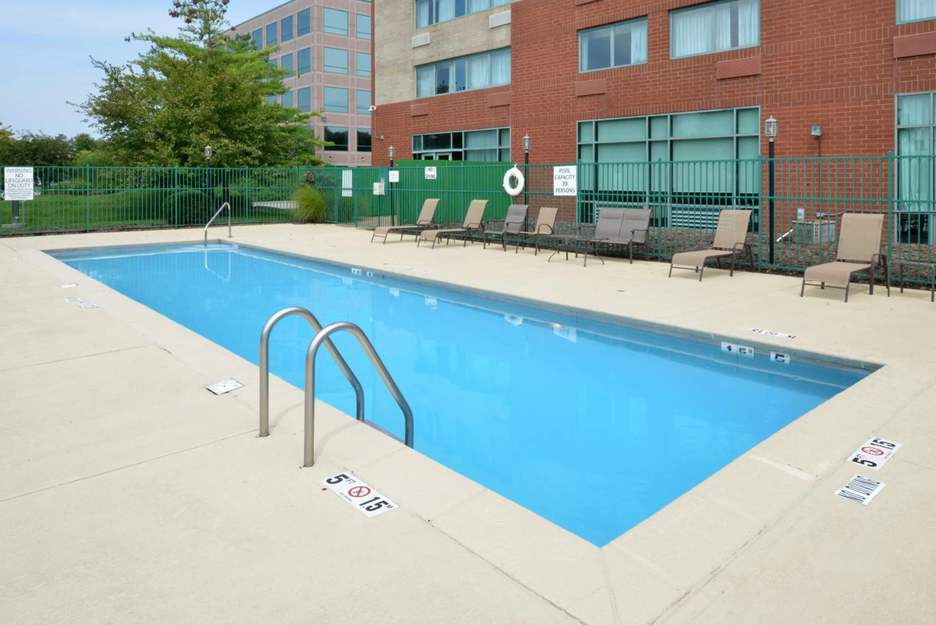 Swimming pool in Elimwood Hotel, a Ramada by Wyndham