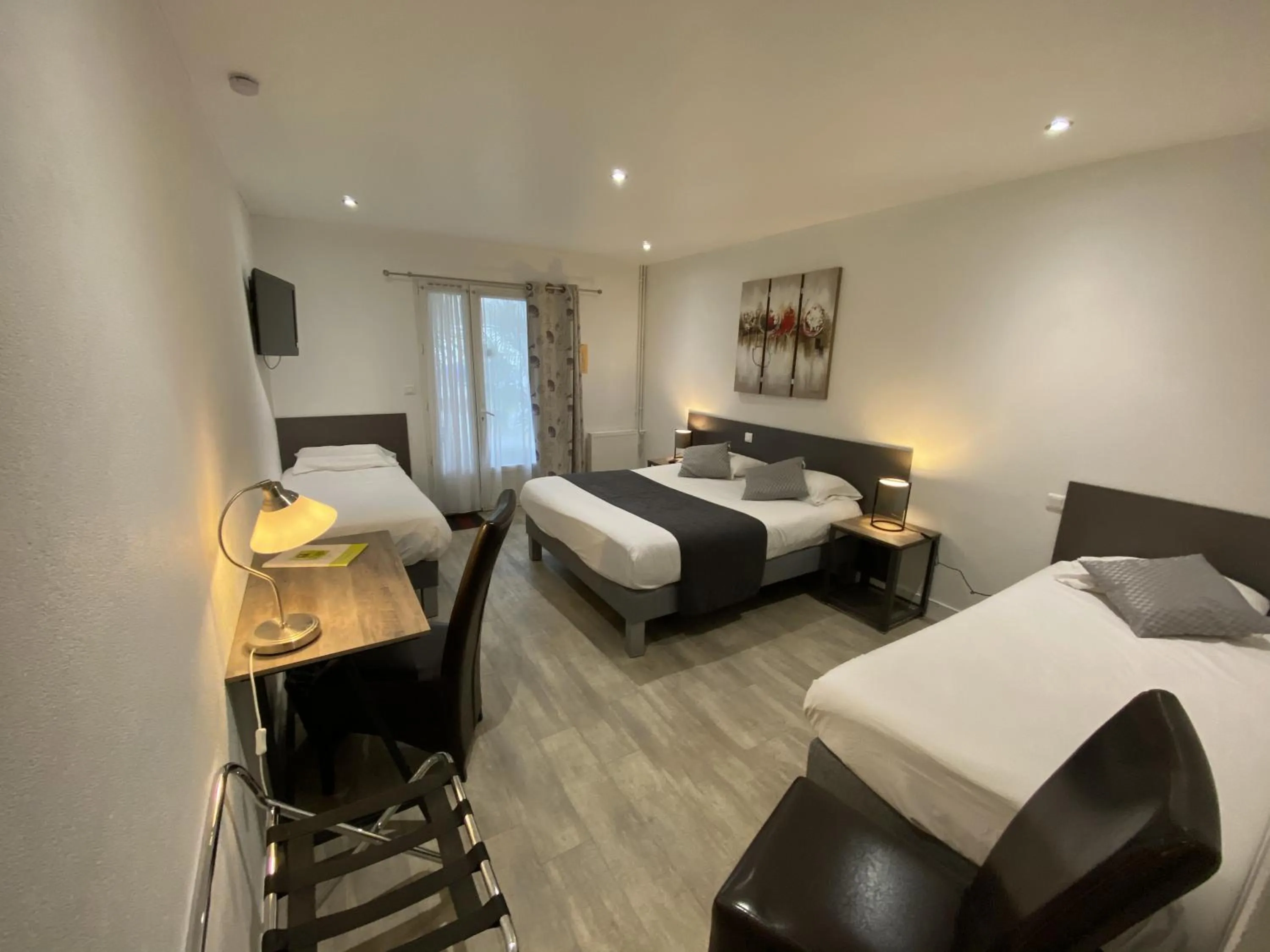 Bed in Logis Hôtel L'Oliveraie