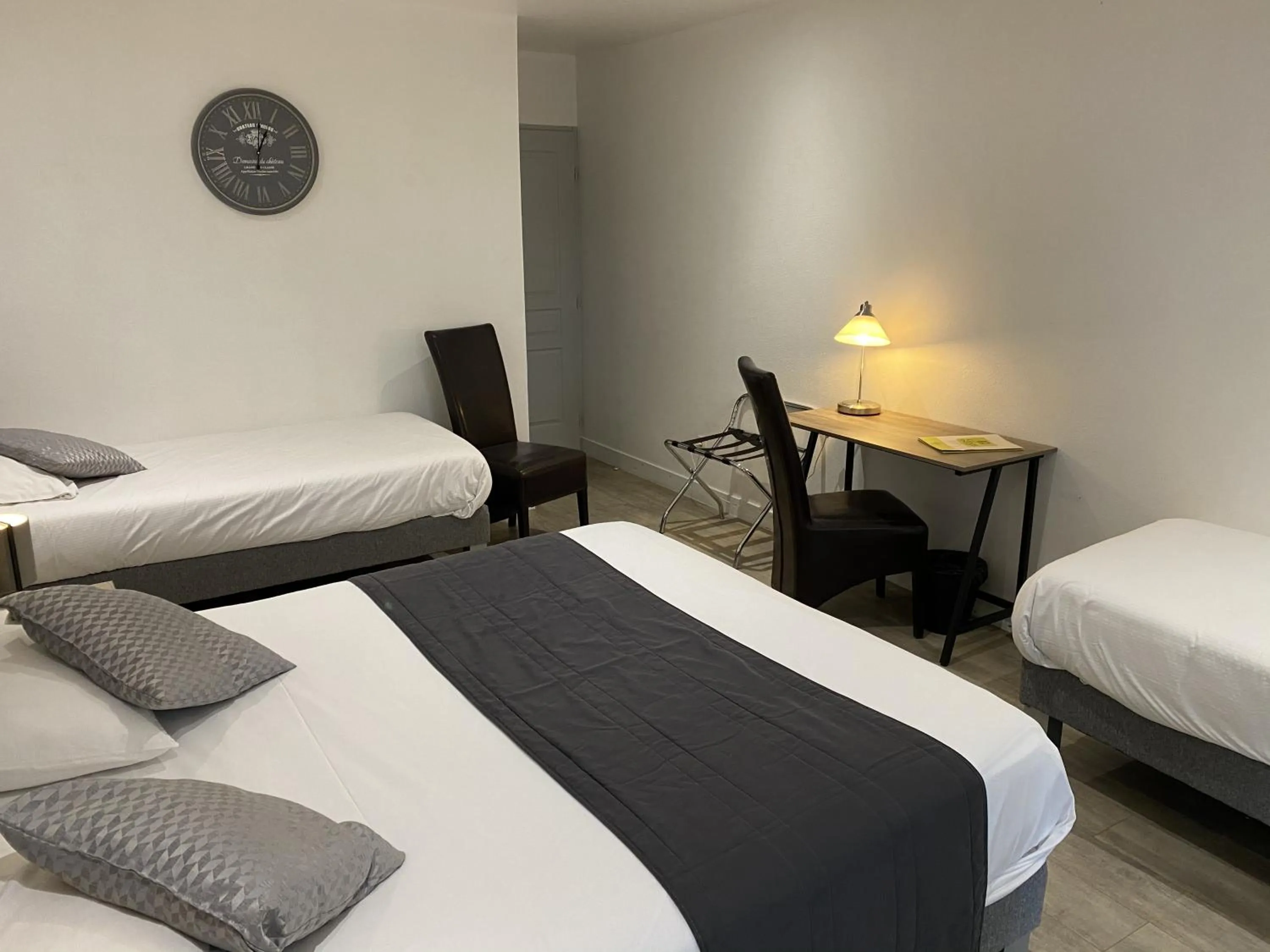 Bed in Logis Hôtel L'Oliveraie