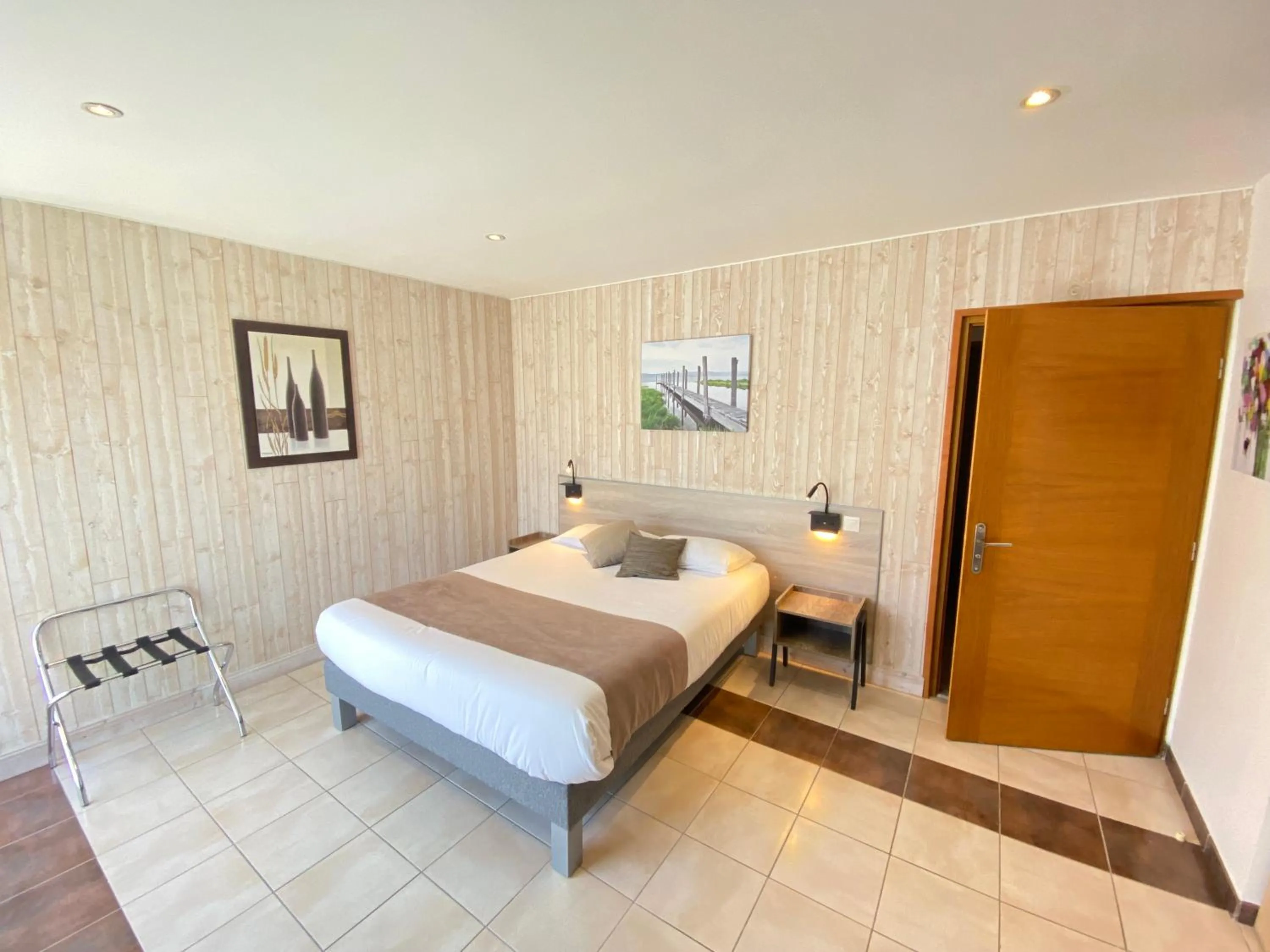 Bed in Logis Hôtel L'Oliveraie