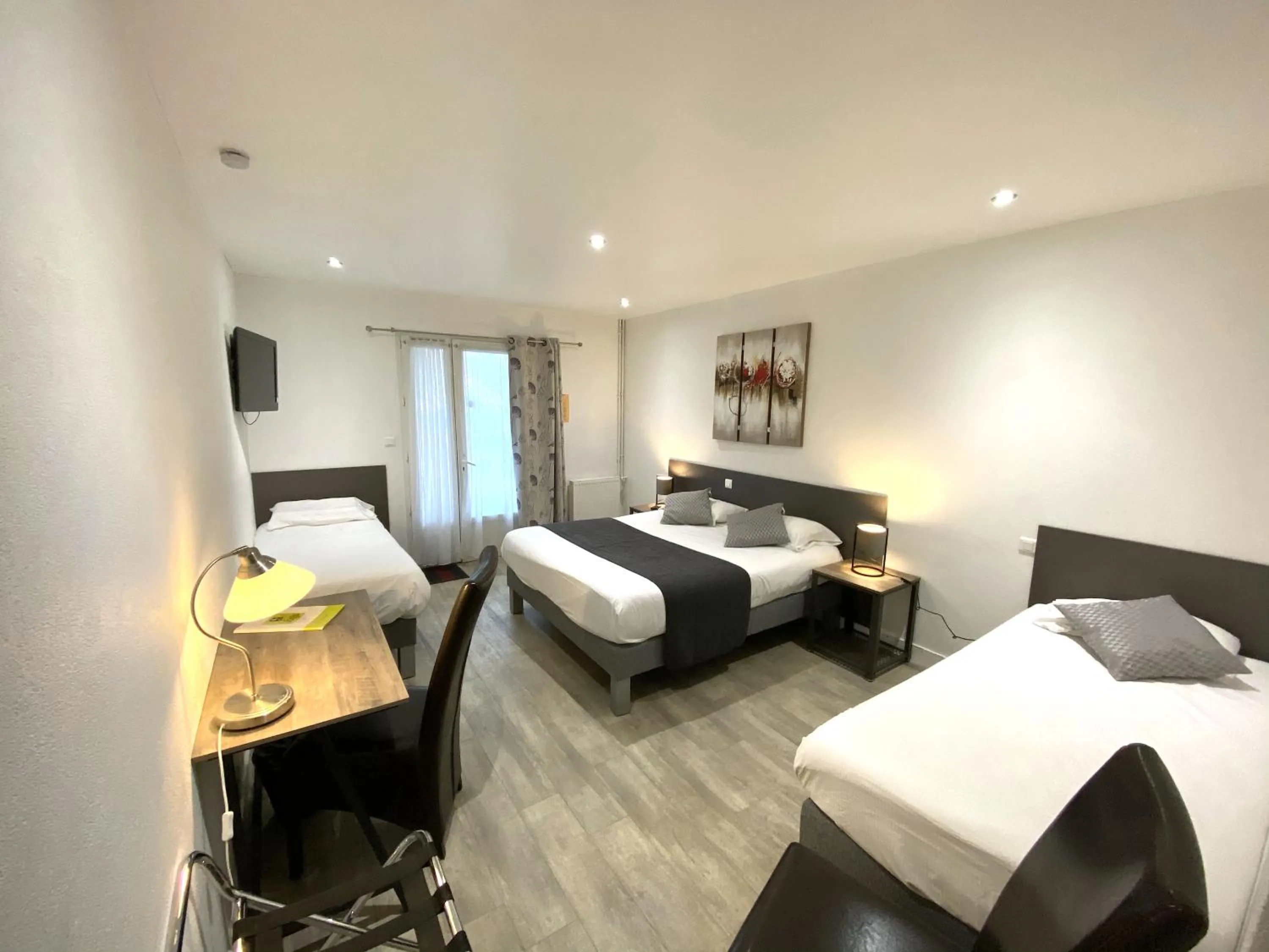 Bed in Logis Hôtel L'Oliveraie