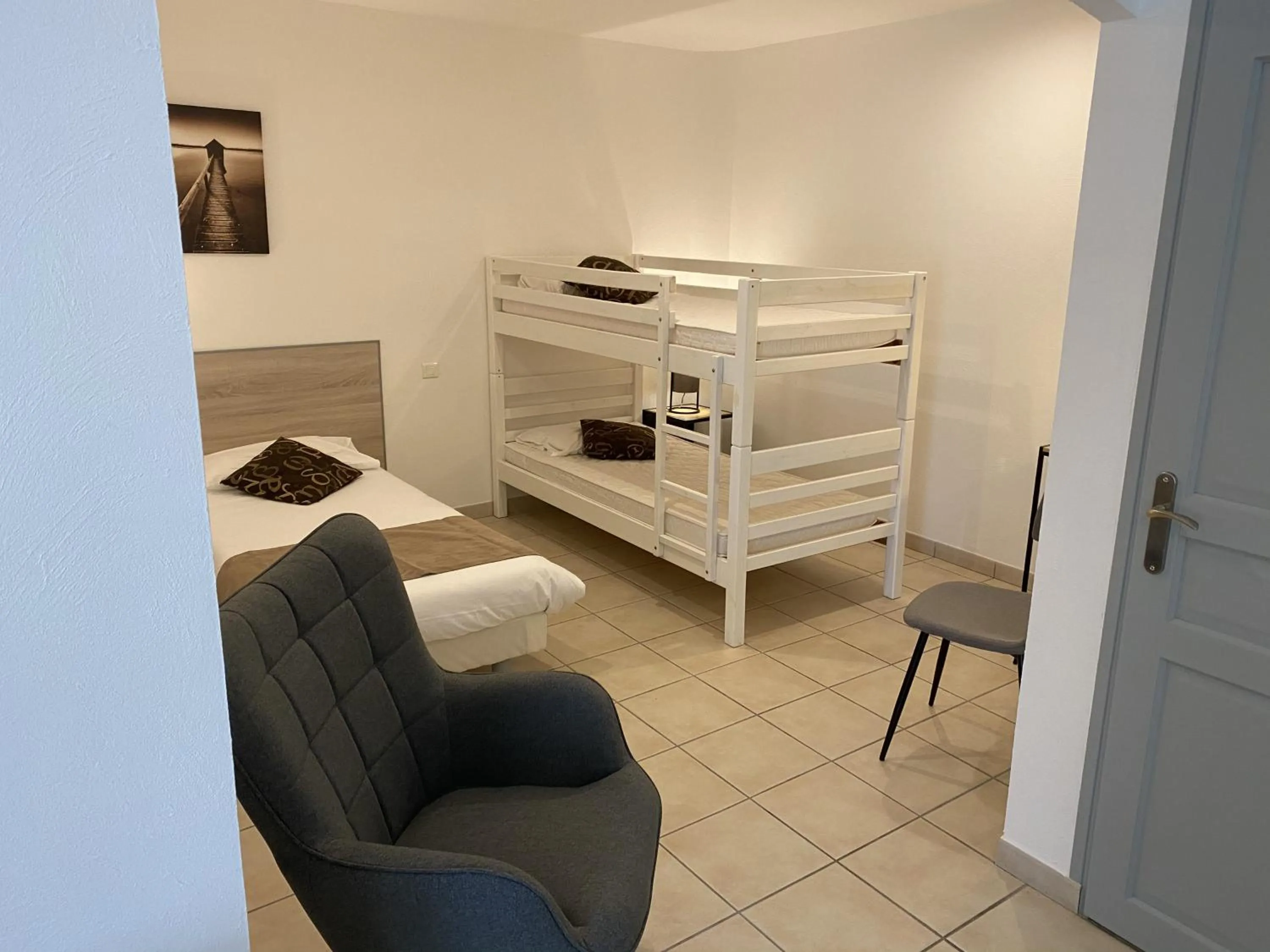 Bed in Logis Hôtel L'Oliveraie