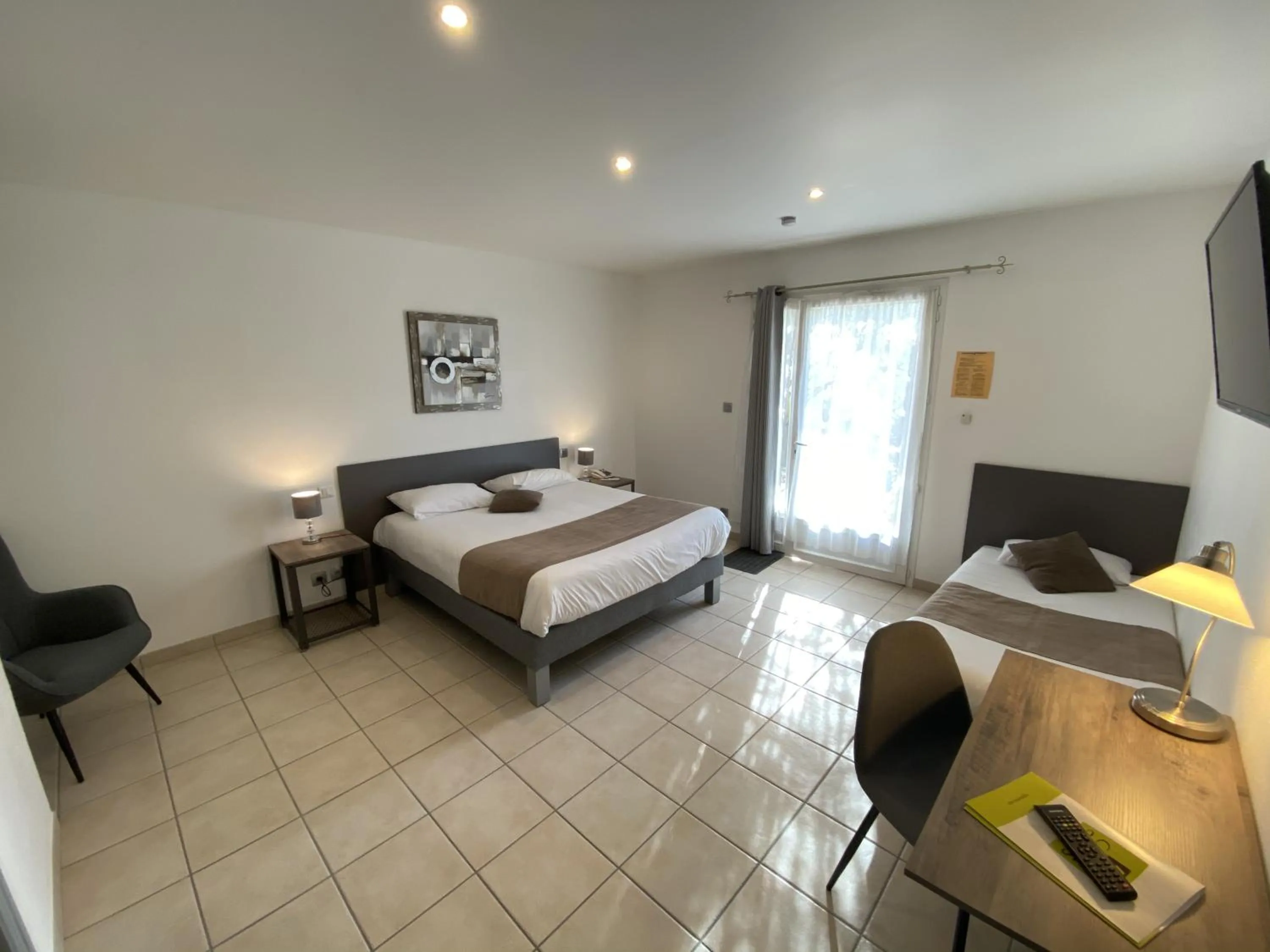 Bed in Logis Hôtel L'Oliveraie