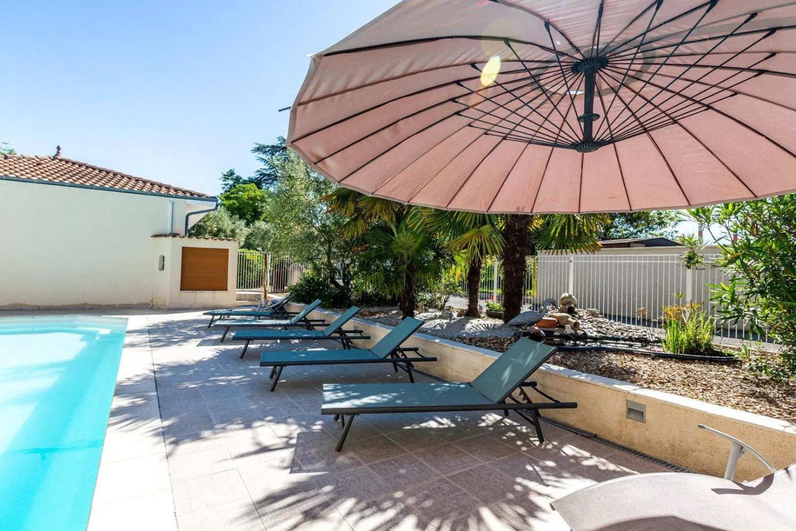 Swimming pool in Logis Hôtel L'Oliveraie