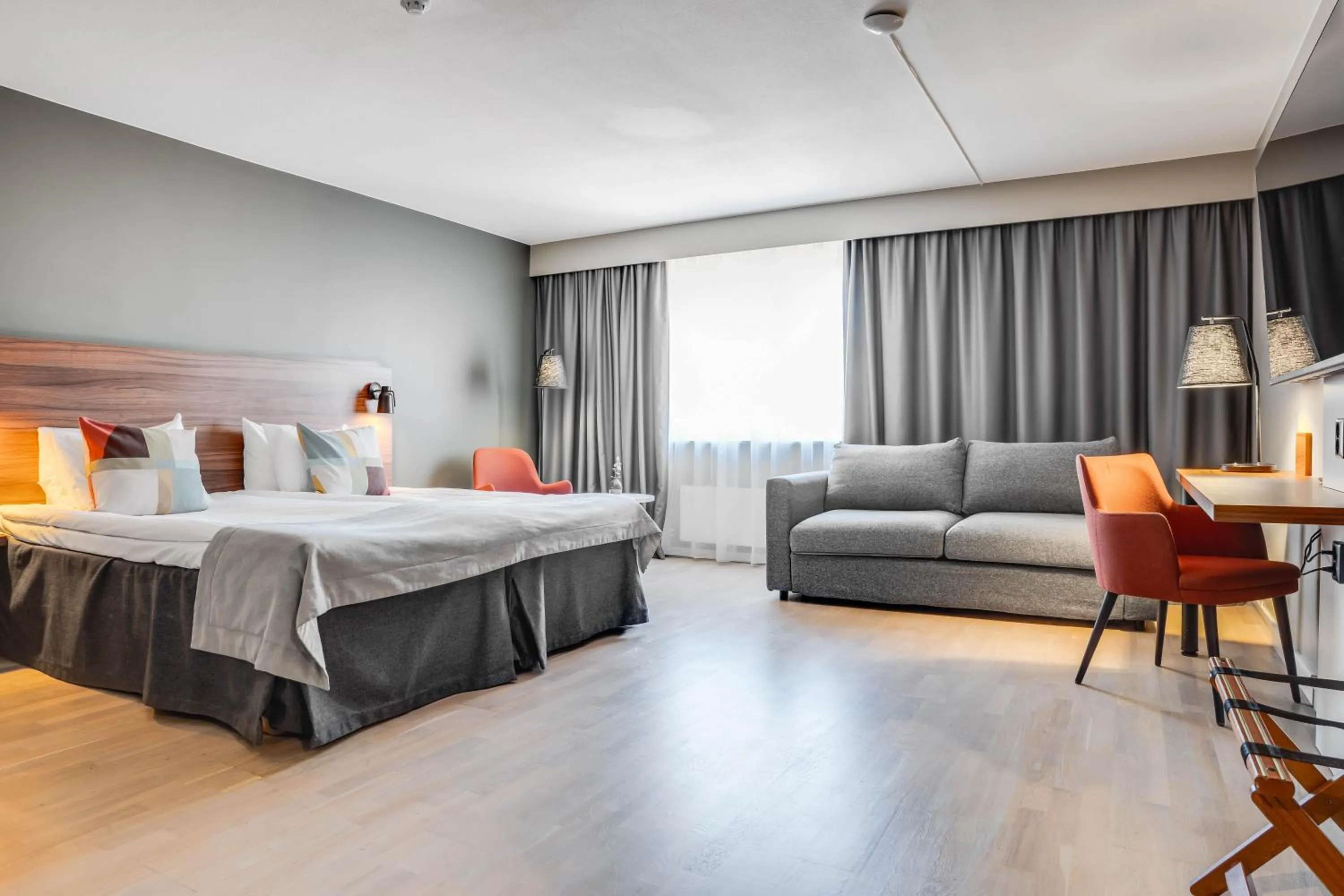 Seating area, Bed in ProfilHotels Grand Kristianstad