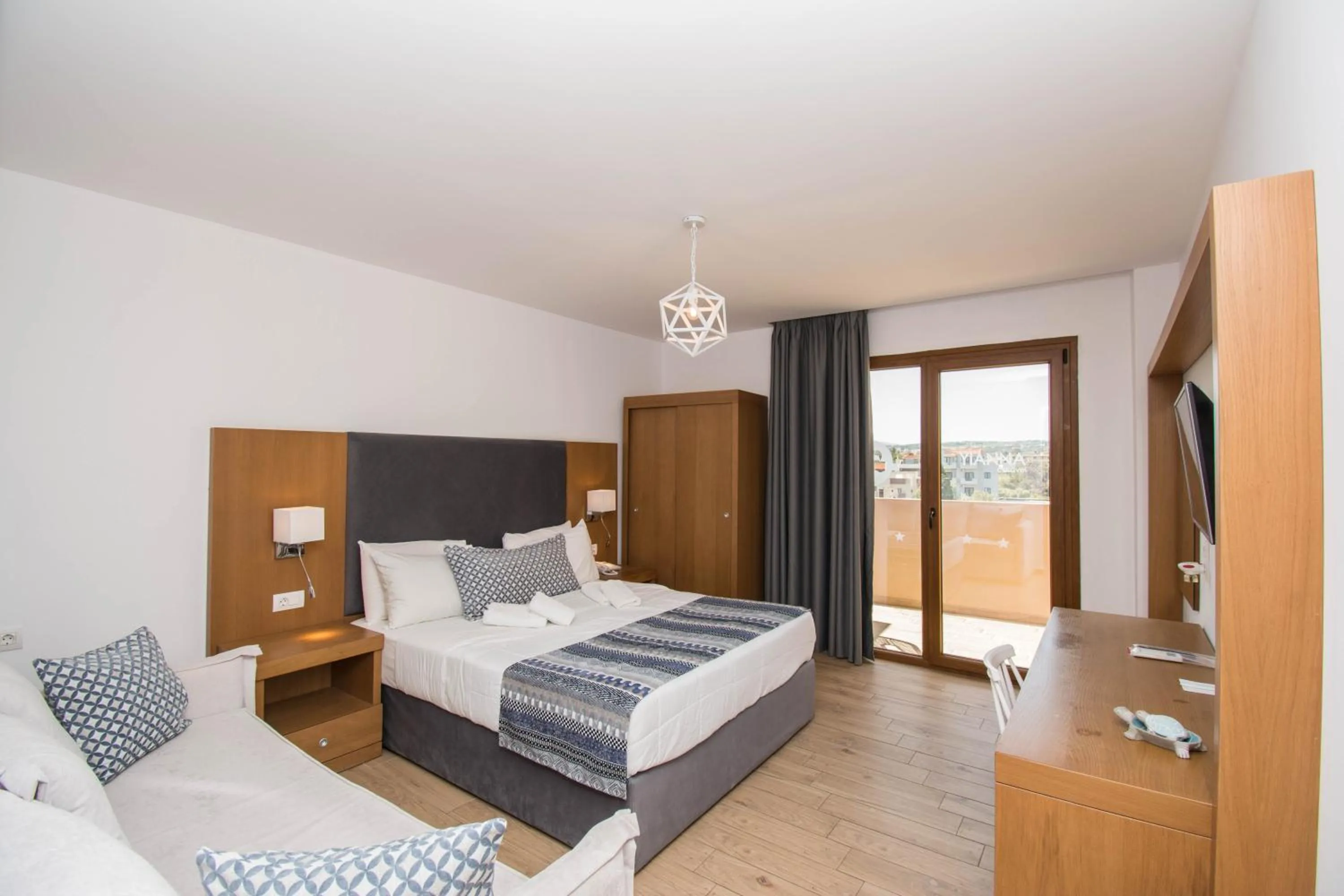 Seating area, Bed in Yianna Caravel Suites "by Checkin" adults only