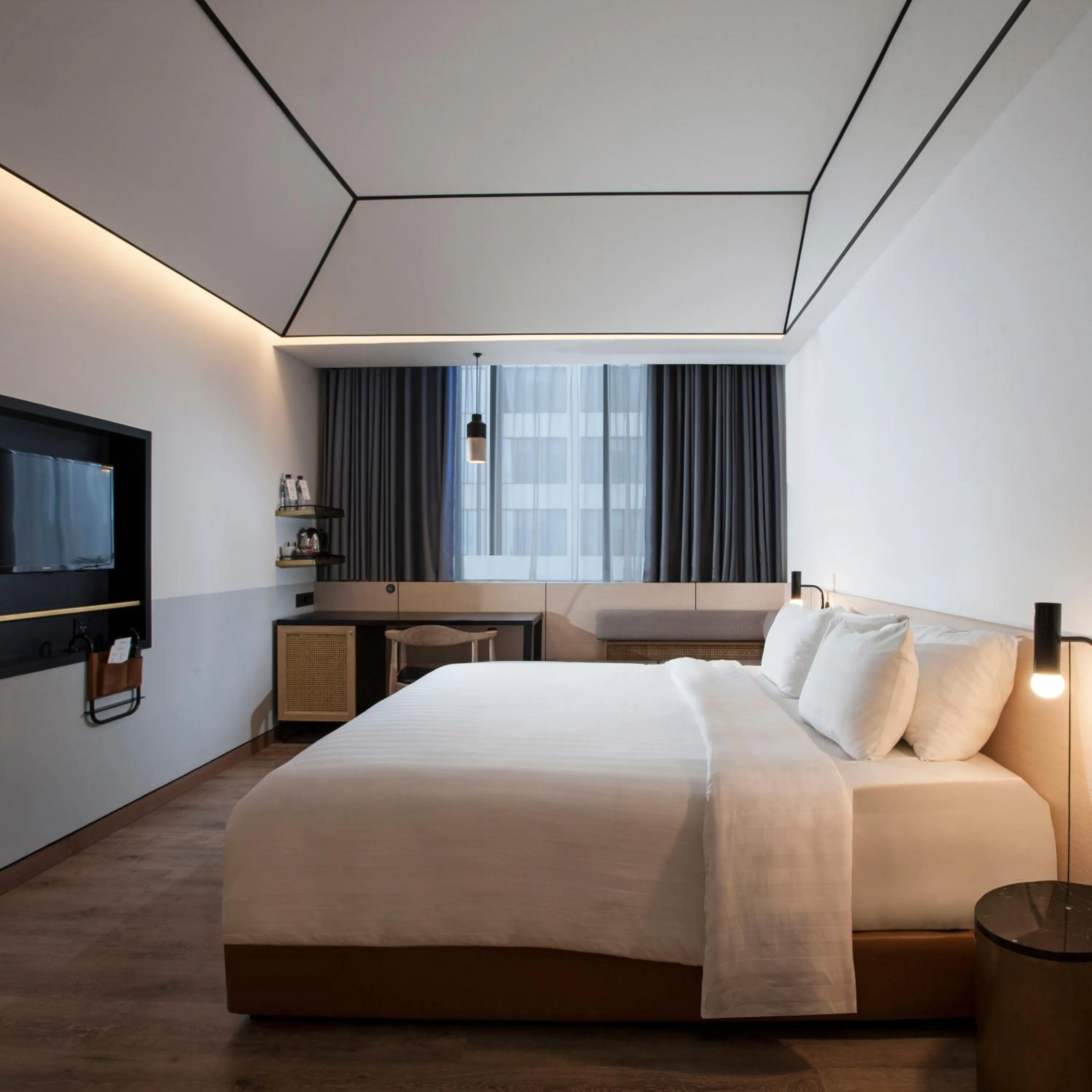 Bed in GAIA Cosmo Hotel