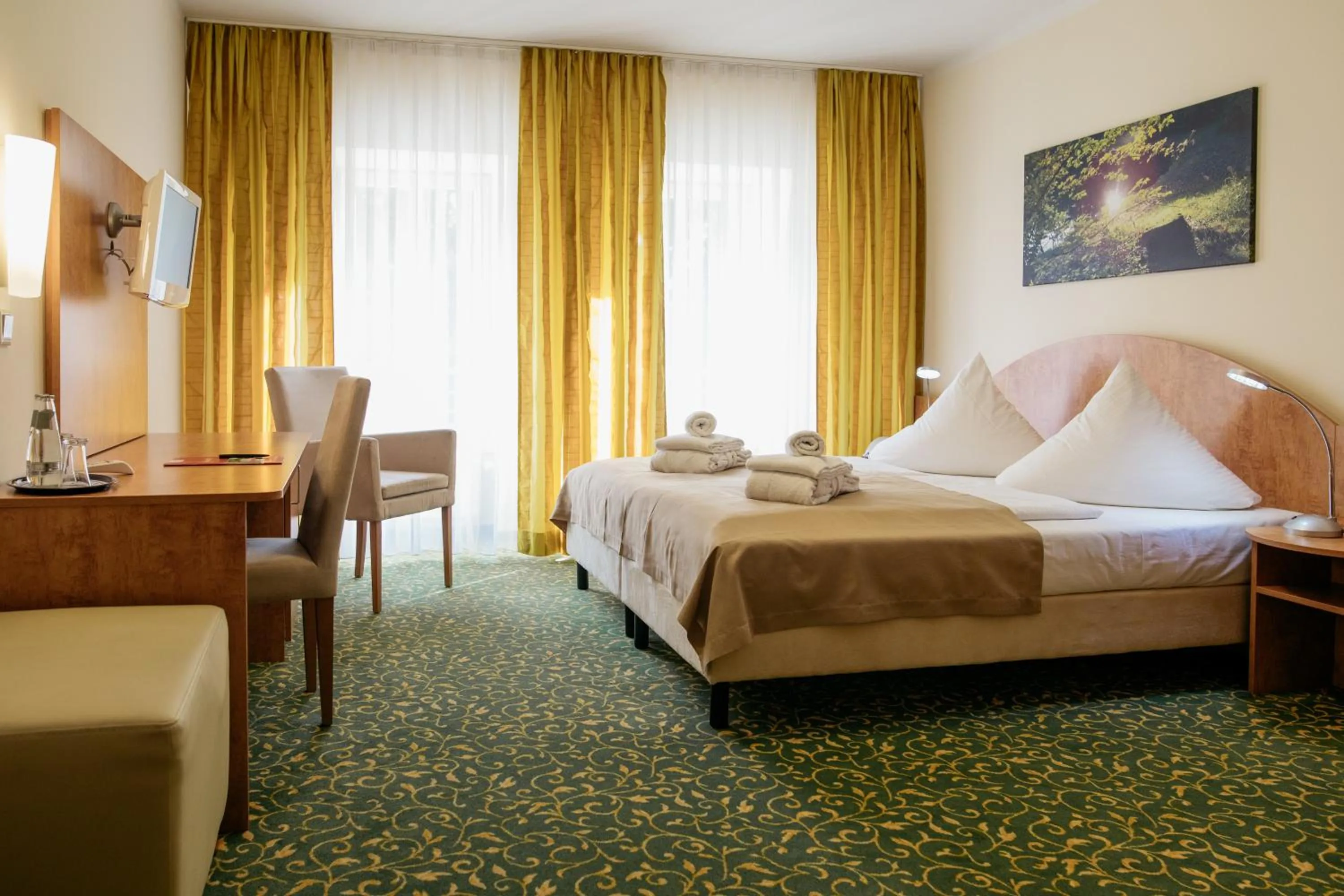 Photo of the whole room, Bed in Kulturhotel Fürst Pückler Park