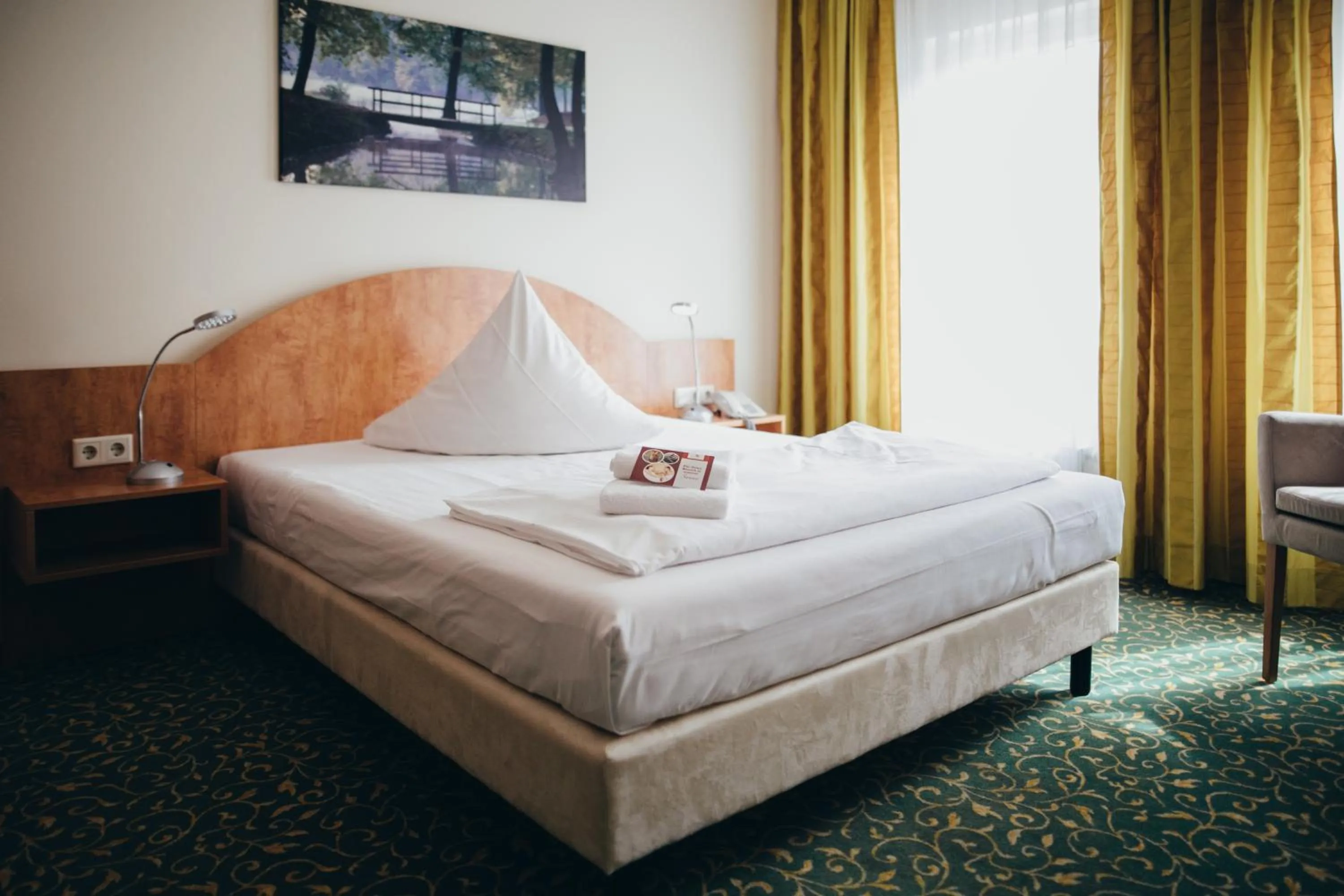 Photo of the whole room, Bed in Kulturhotel Fürst Pückler Park