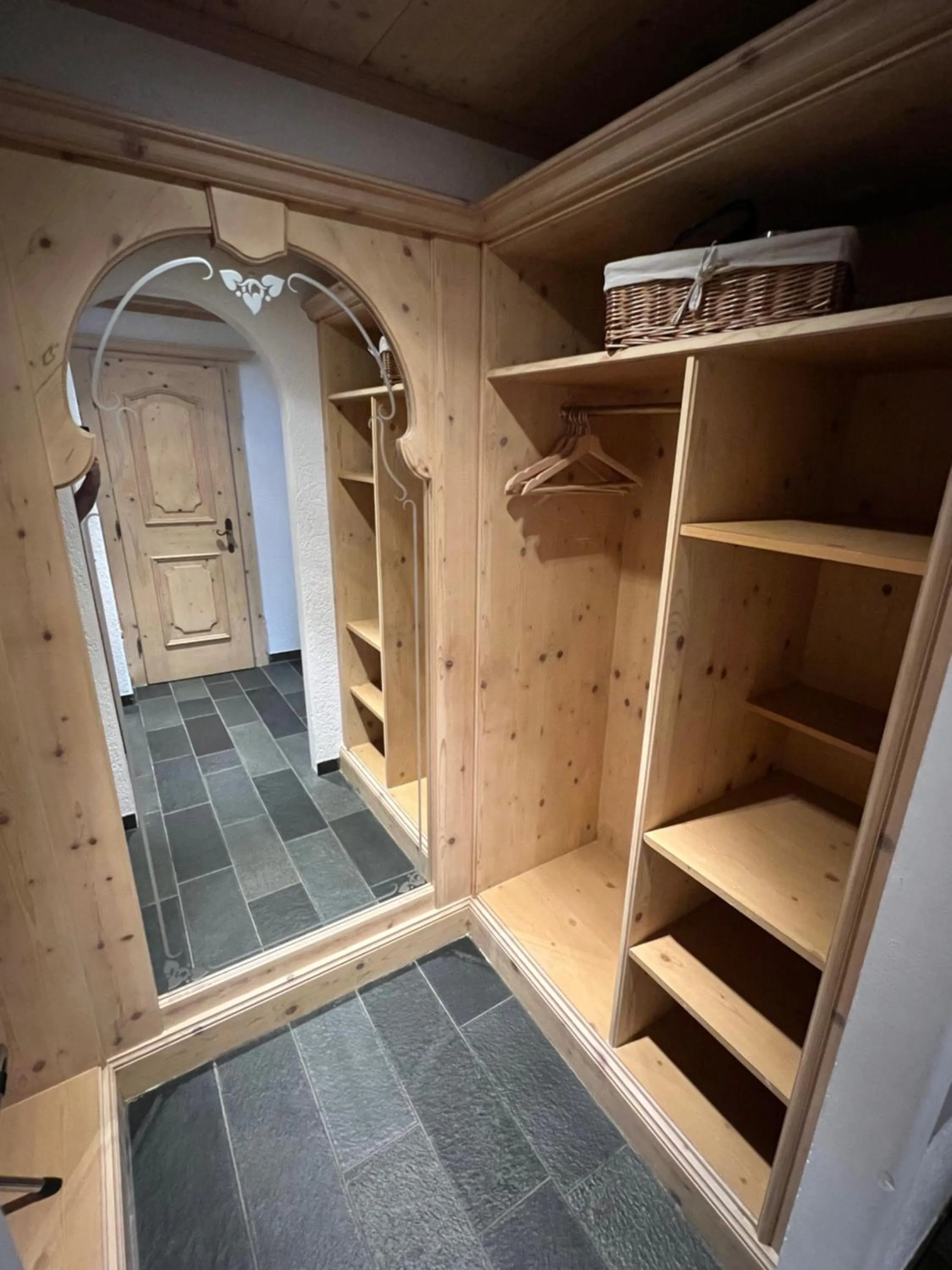 wardrobe in SPANNORT family home with common kitchen and self check-in