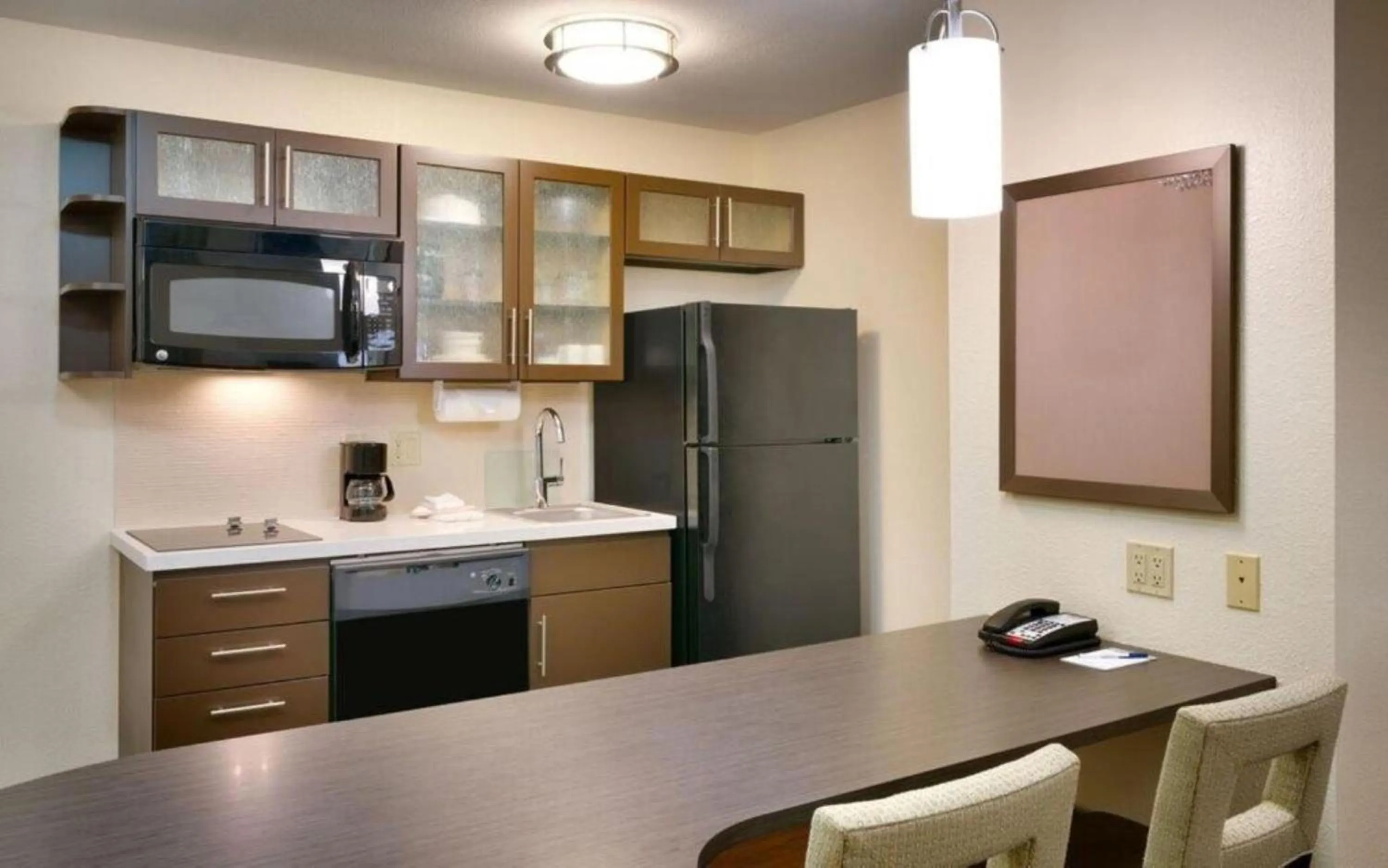 Kitchen or kitchenette in Candlewood Suites Plano East by IHG