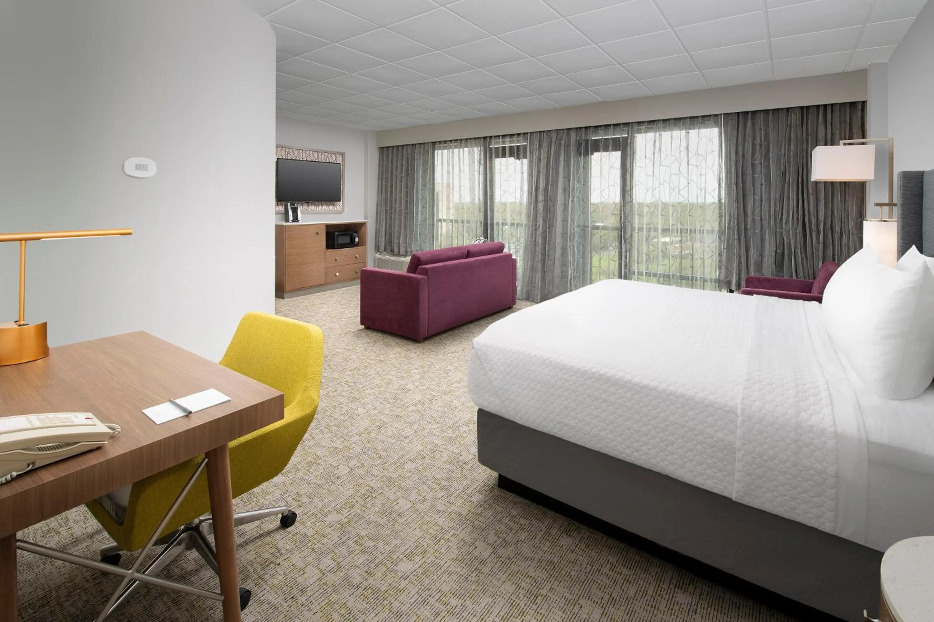 Living room, Bed in Crowne Plaza San Antonio Airport by IHG