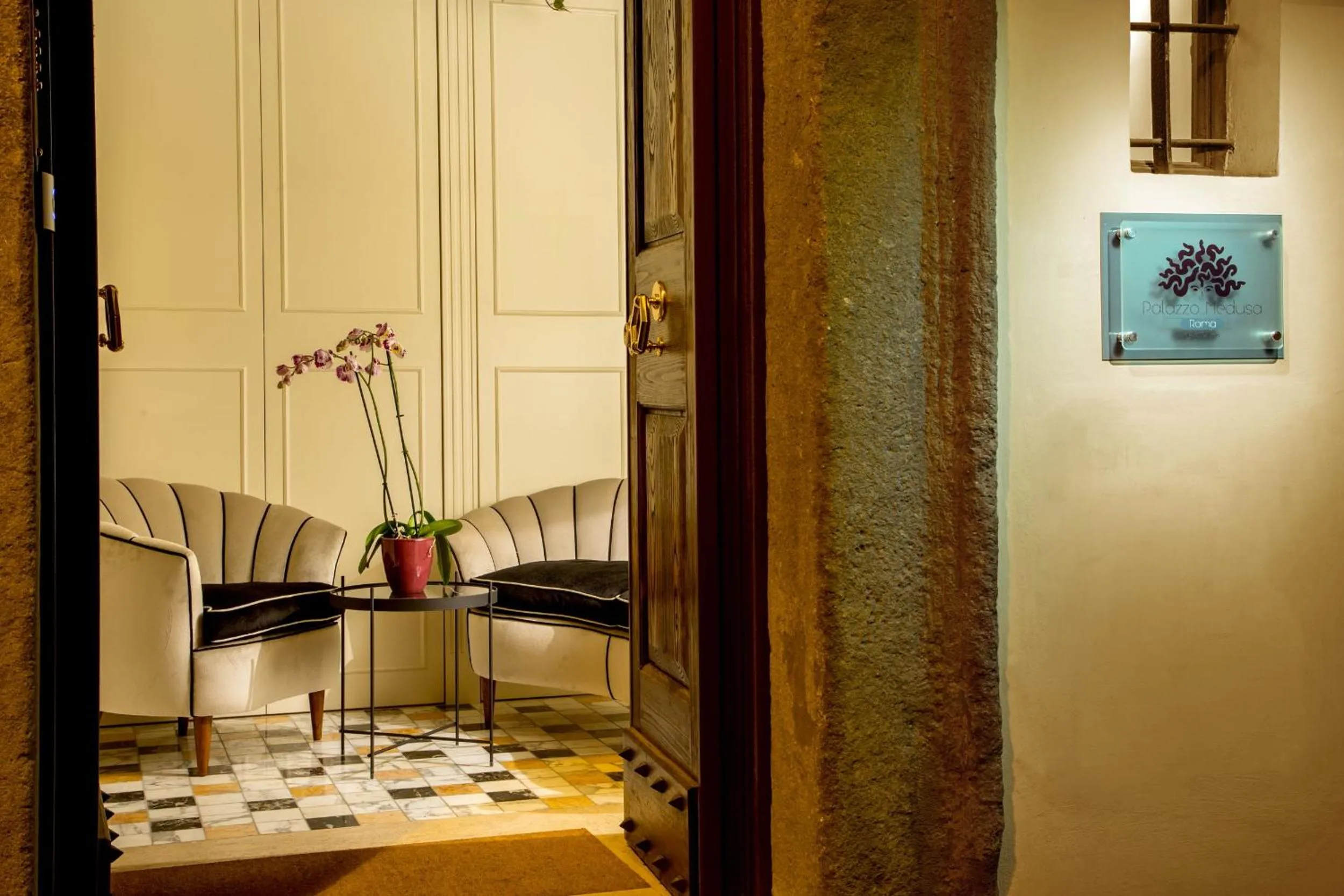 Property logo or sign in Palazzo Medusa