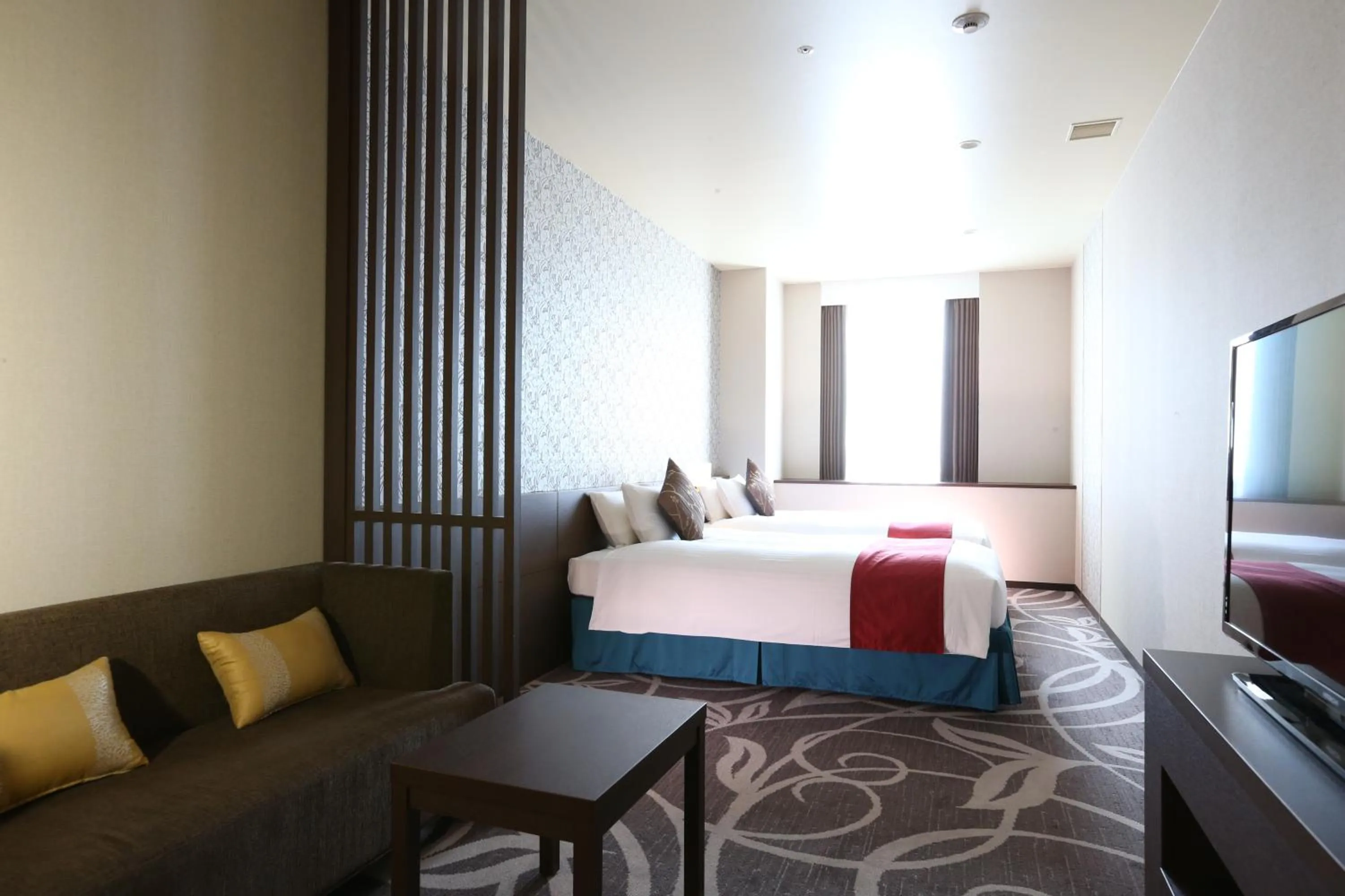 Living room, Bed in Hotel La Raison Osaka