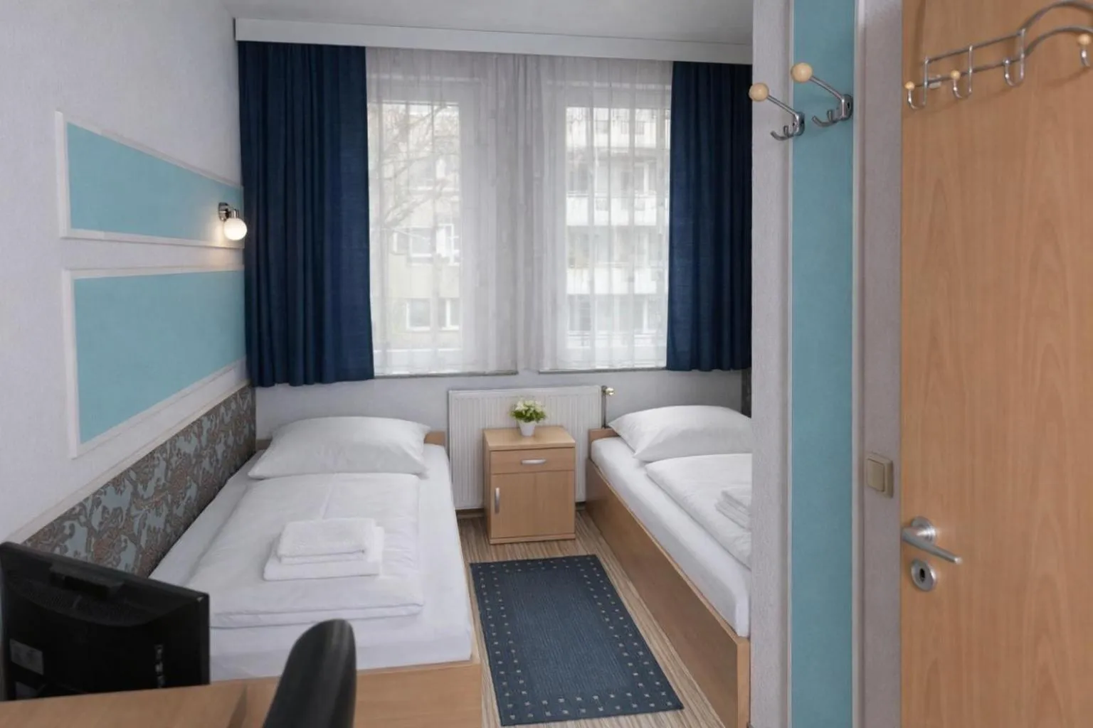 Photo of the whole room, Bed in Pension Central Nuernberg-Fuerth