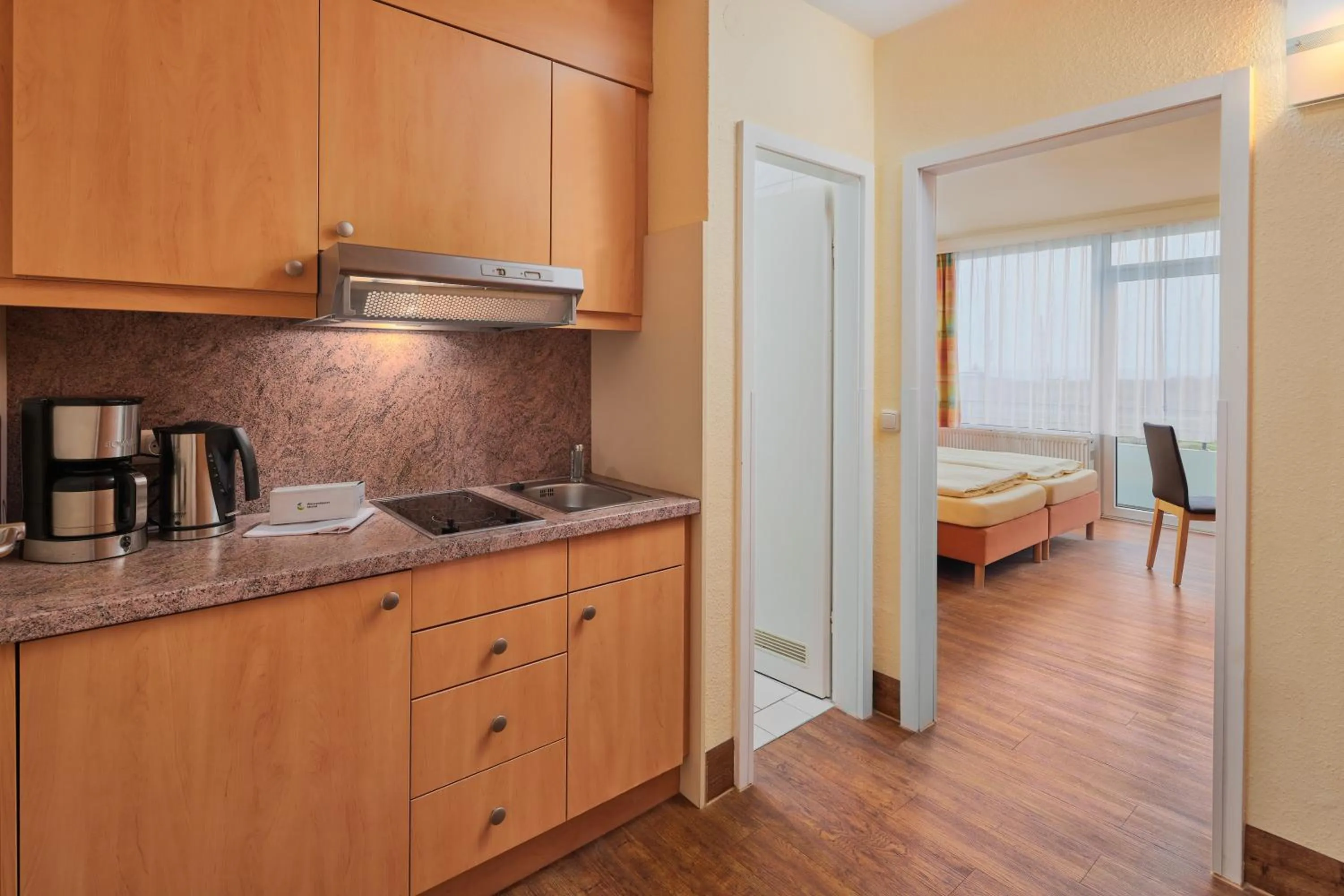 Kitchen or kitchenette, Bed in Ferien- und Freizeitpark Weissenhäuser Strand