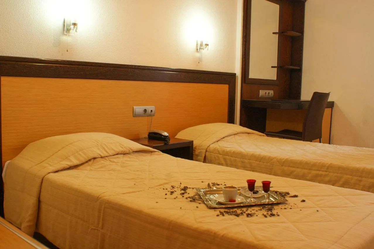 Bed in Aposperides Hotel