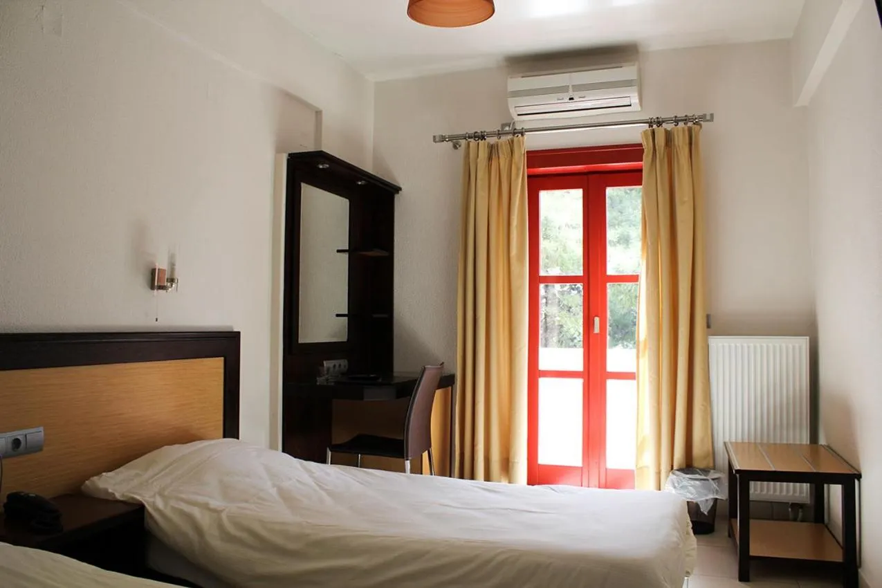 Bed in Aposperides Hotel