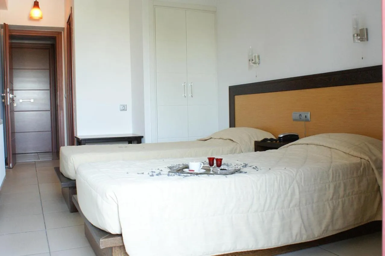 Bed in Aposperides Hotel