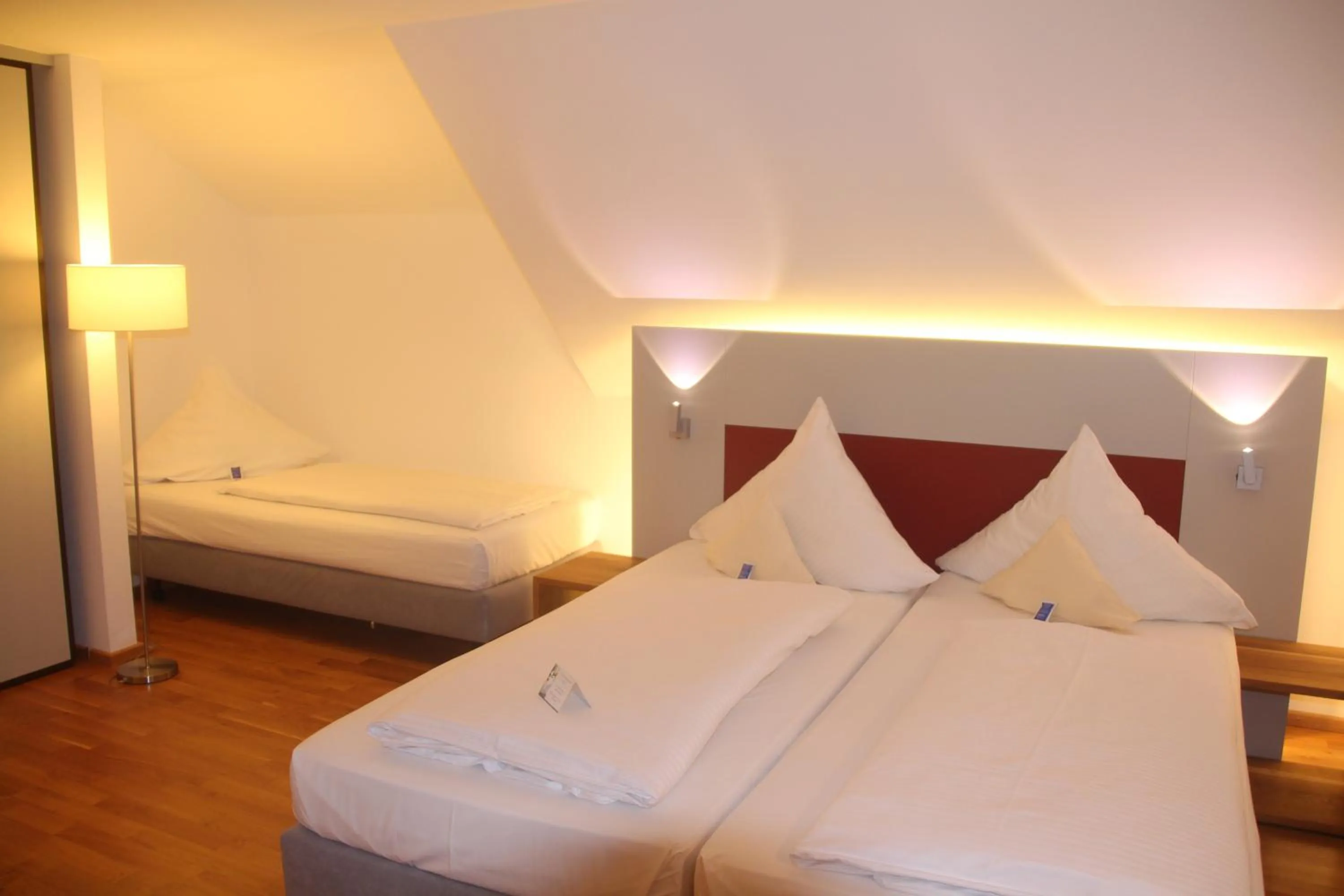 Photo of the whole room, Bed in AKZENT Brauerei Hotel Hirsch