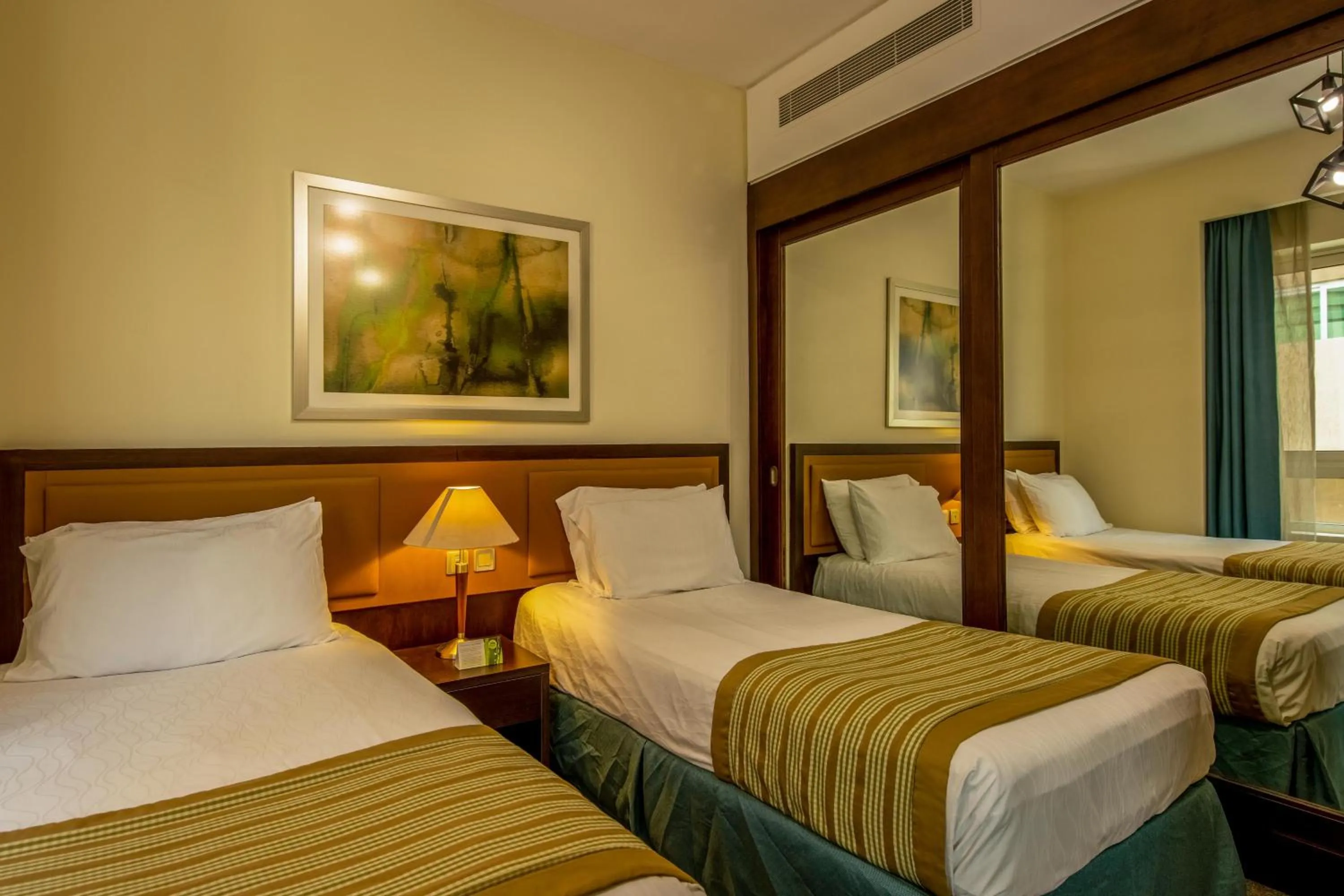 Bed in TIME Ruby Hotel Apartment