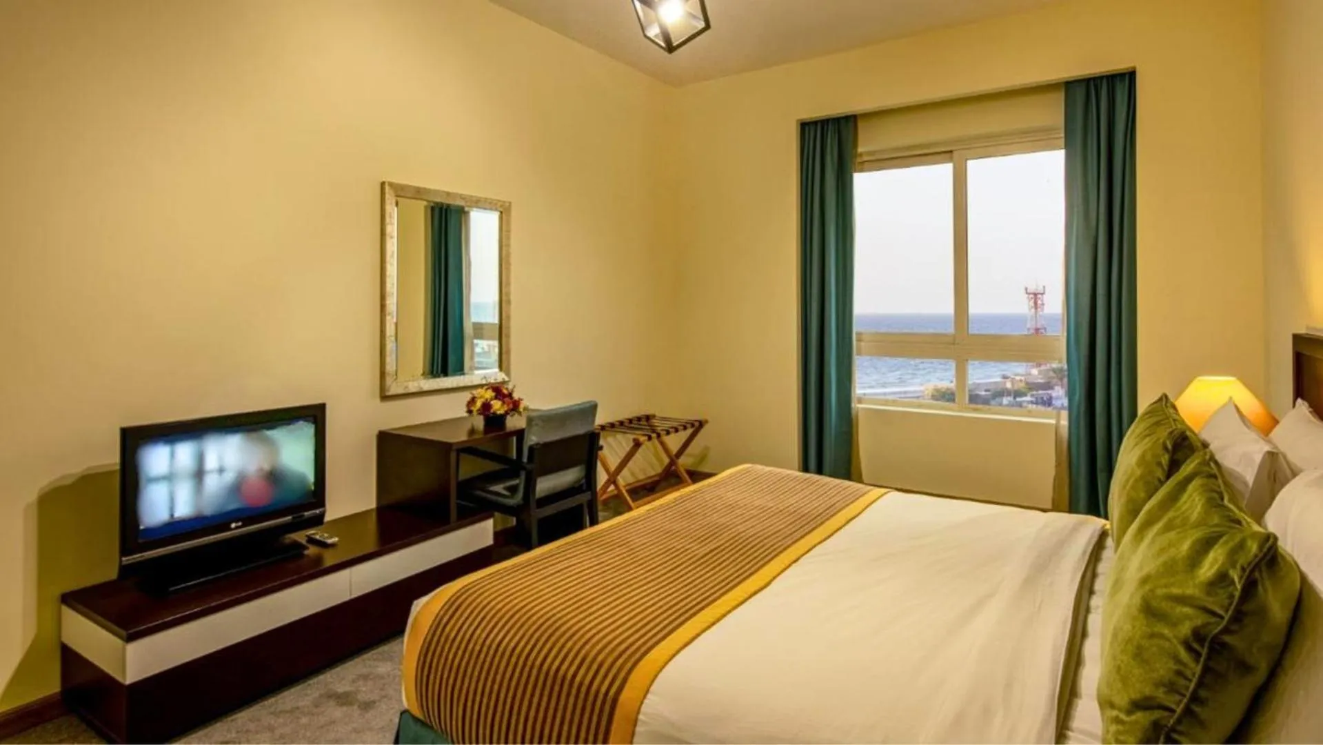 Bed in TIME Ruby Hotel Apartment