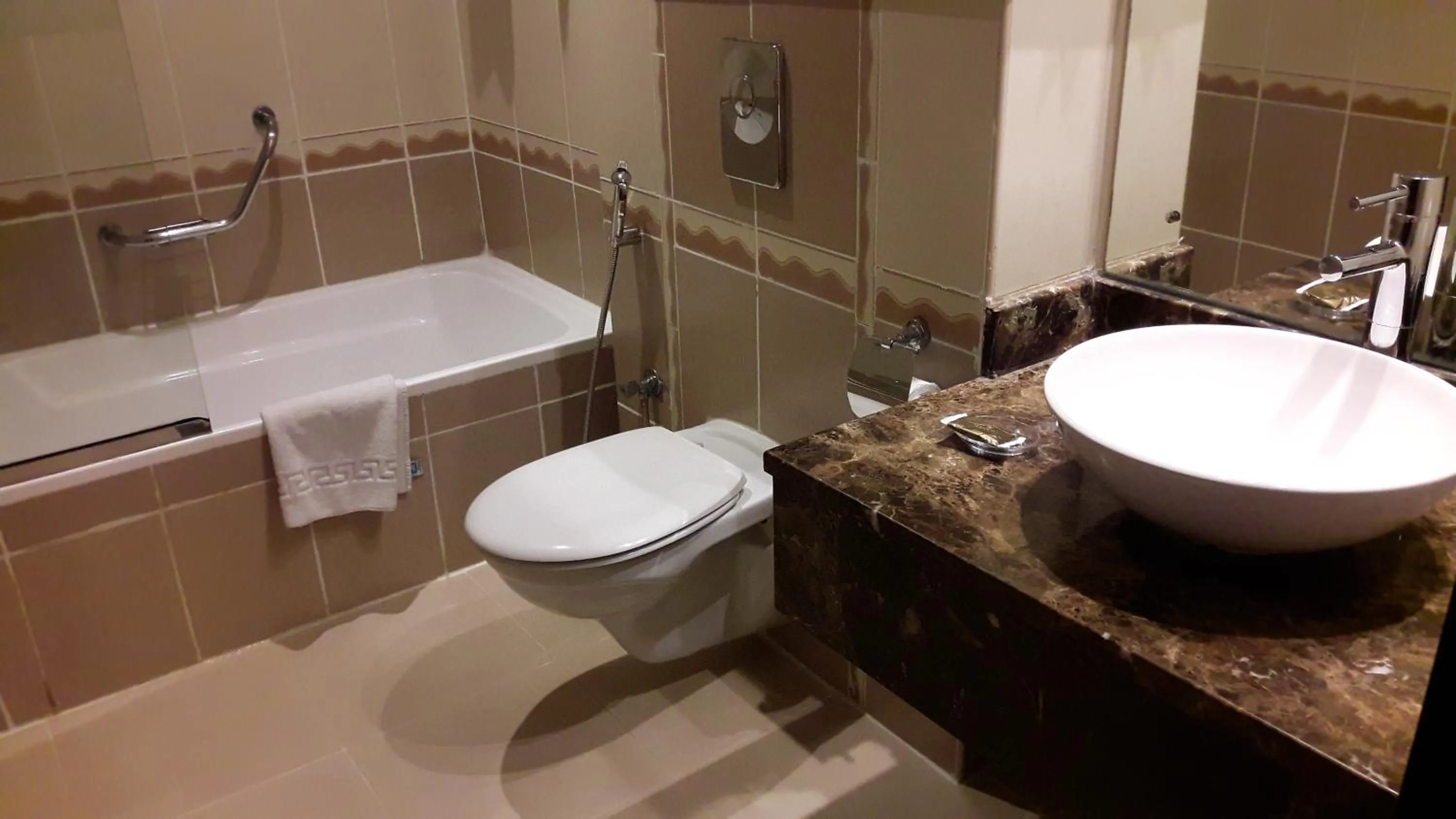 Toilet in Landmark Riqqa Hotel