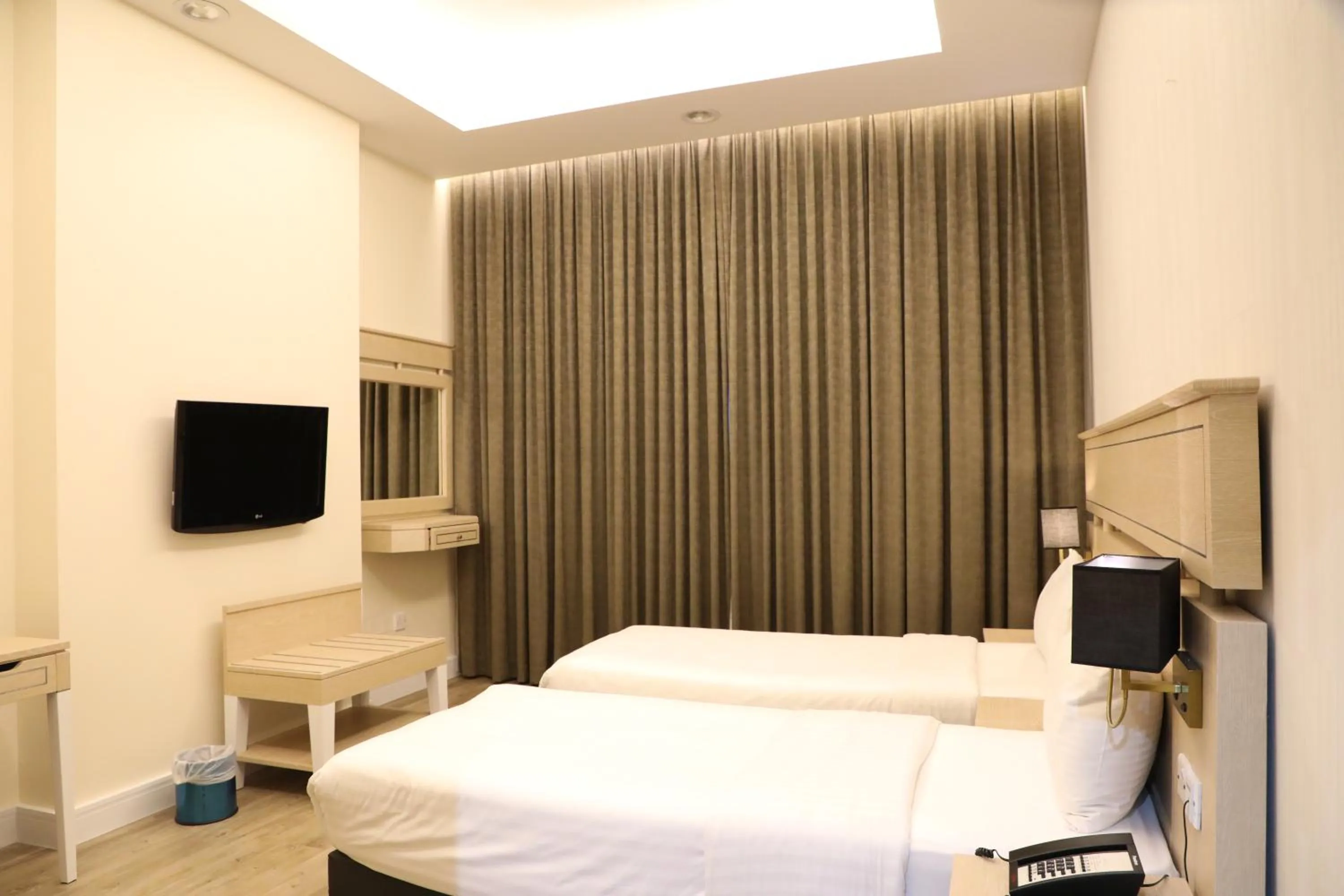 Bed in Wescott Plaza Hotel Apartments LLC Formerly West Zone Plaza Hotel Apts