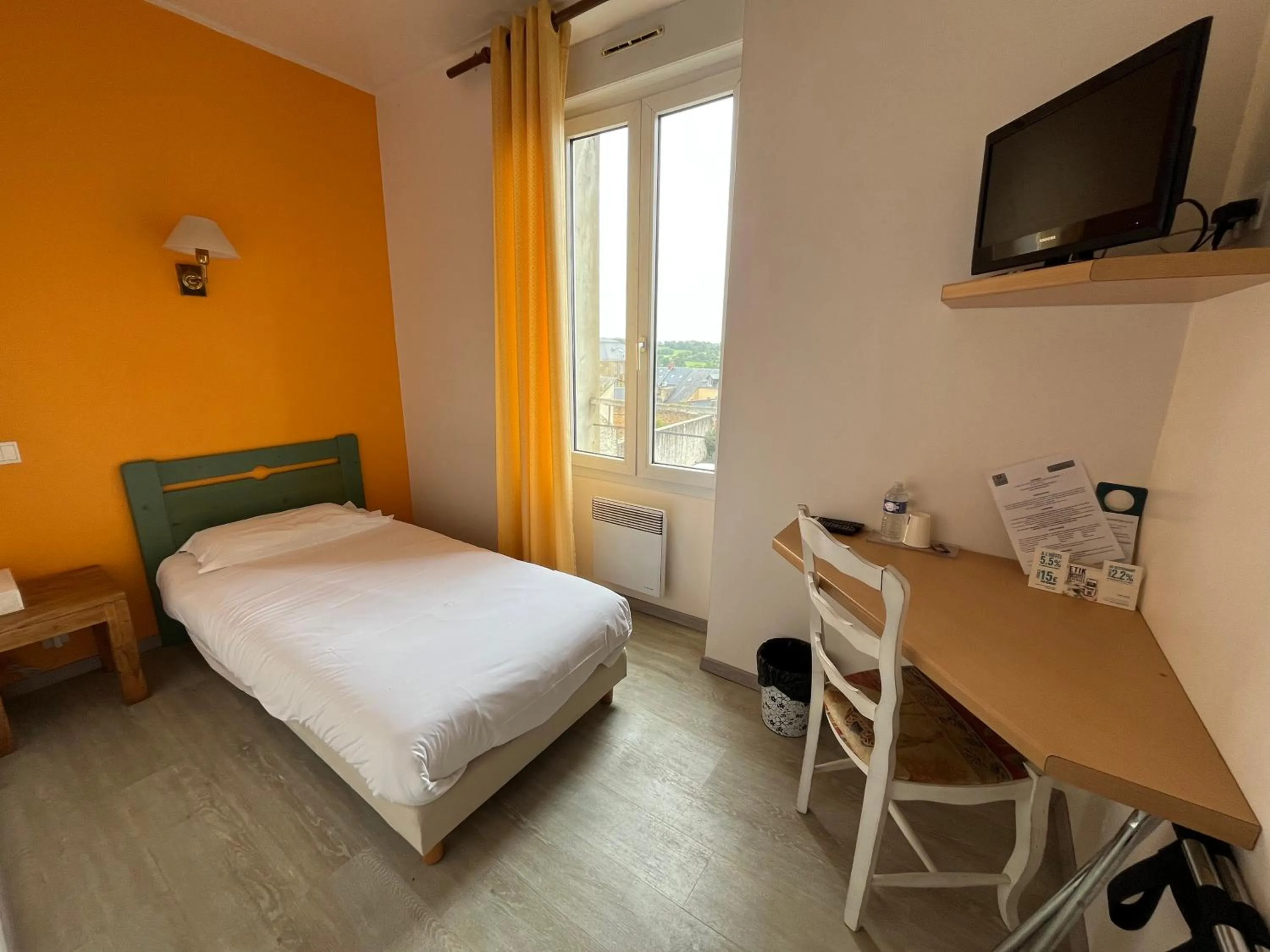 Bed in Logis Hôtel & Restaurant - Le Bretagne