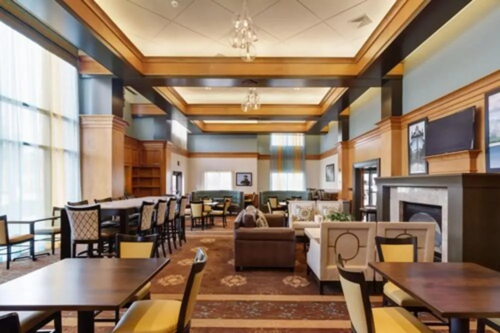 Communal lounge/ TV room in Holiday Inn Express Hotel & Suites Warwick-Providence Airport by IHG