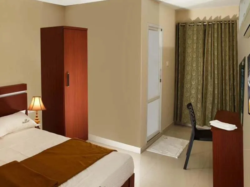 Seating area, Bed in Dream Land Residency