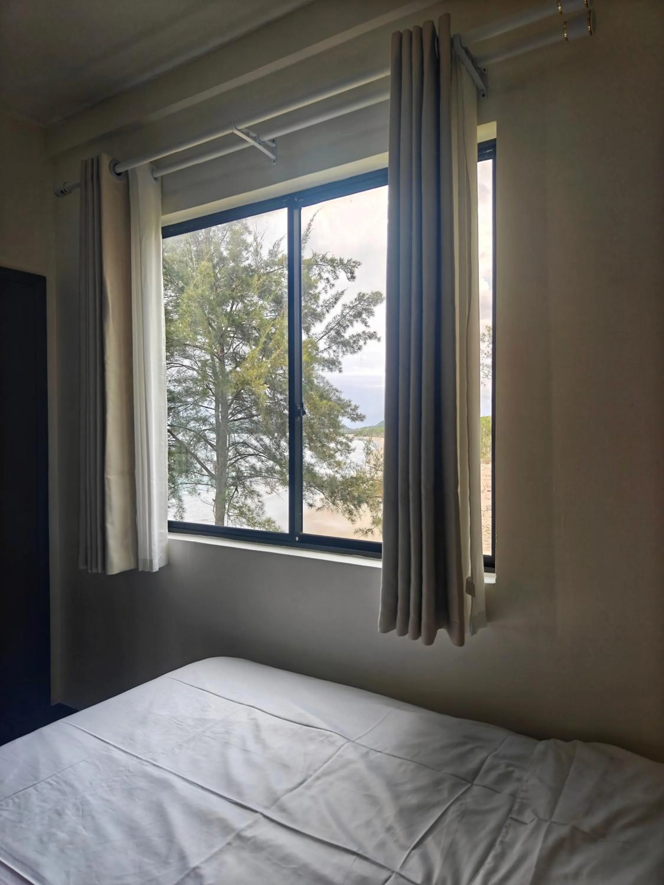 Bed in Sabah Beach Villas & Suites