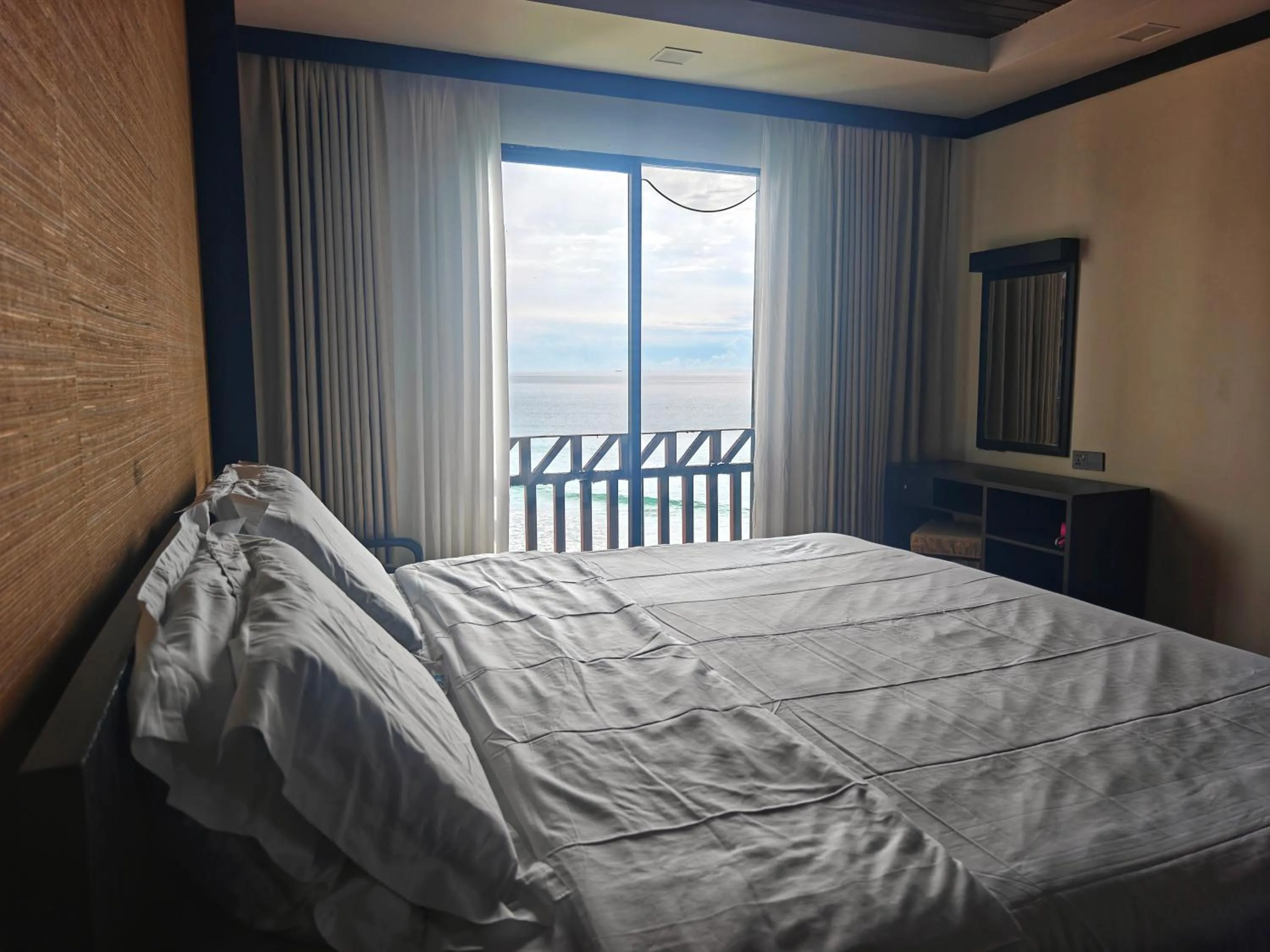 Bed in Sabah Beach Villas & Suites