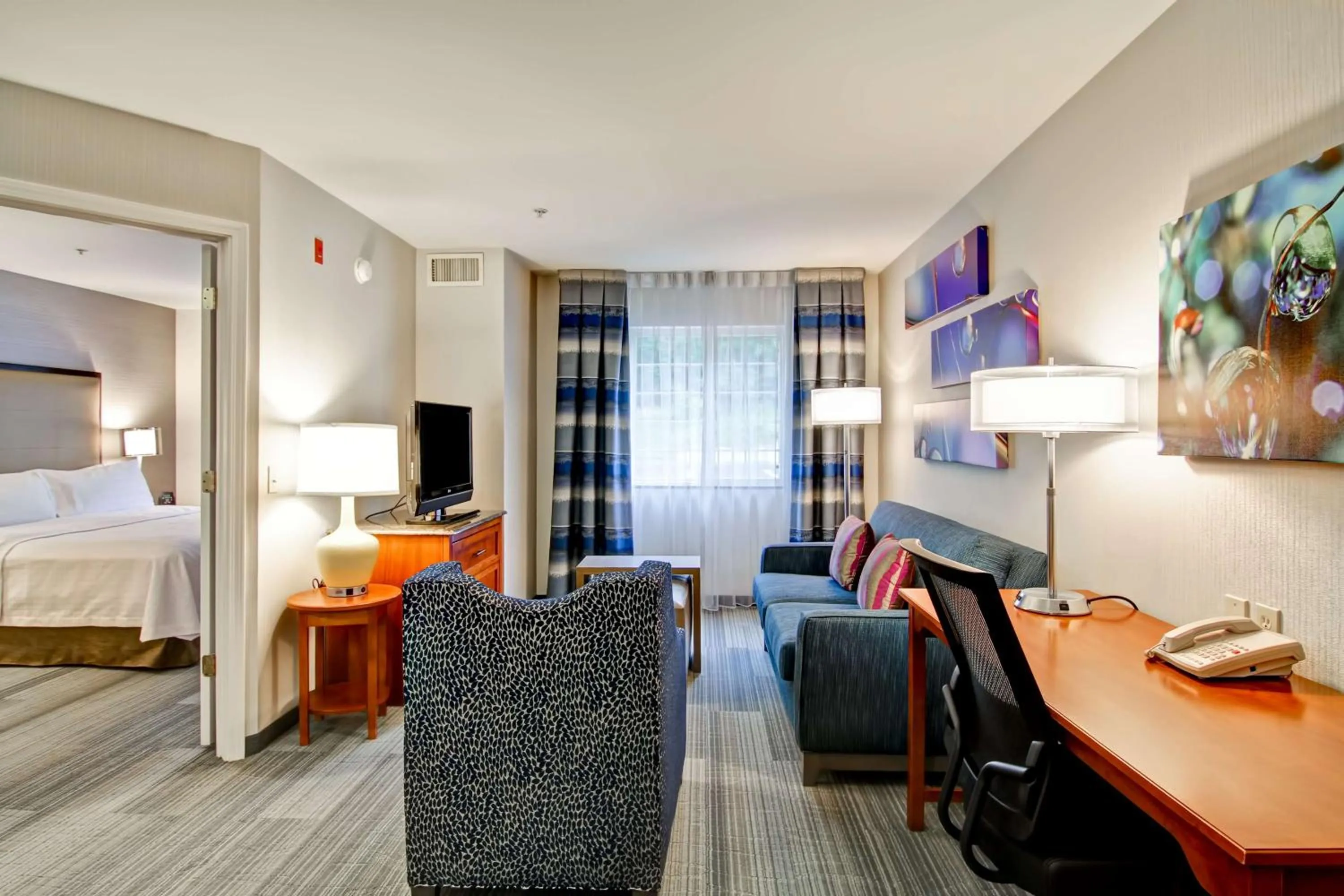 Living room, Bed in Homewood Suites by Hilton Stratford