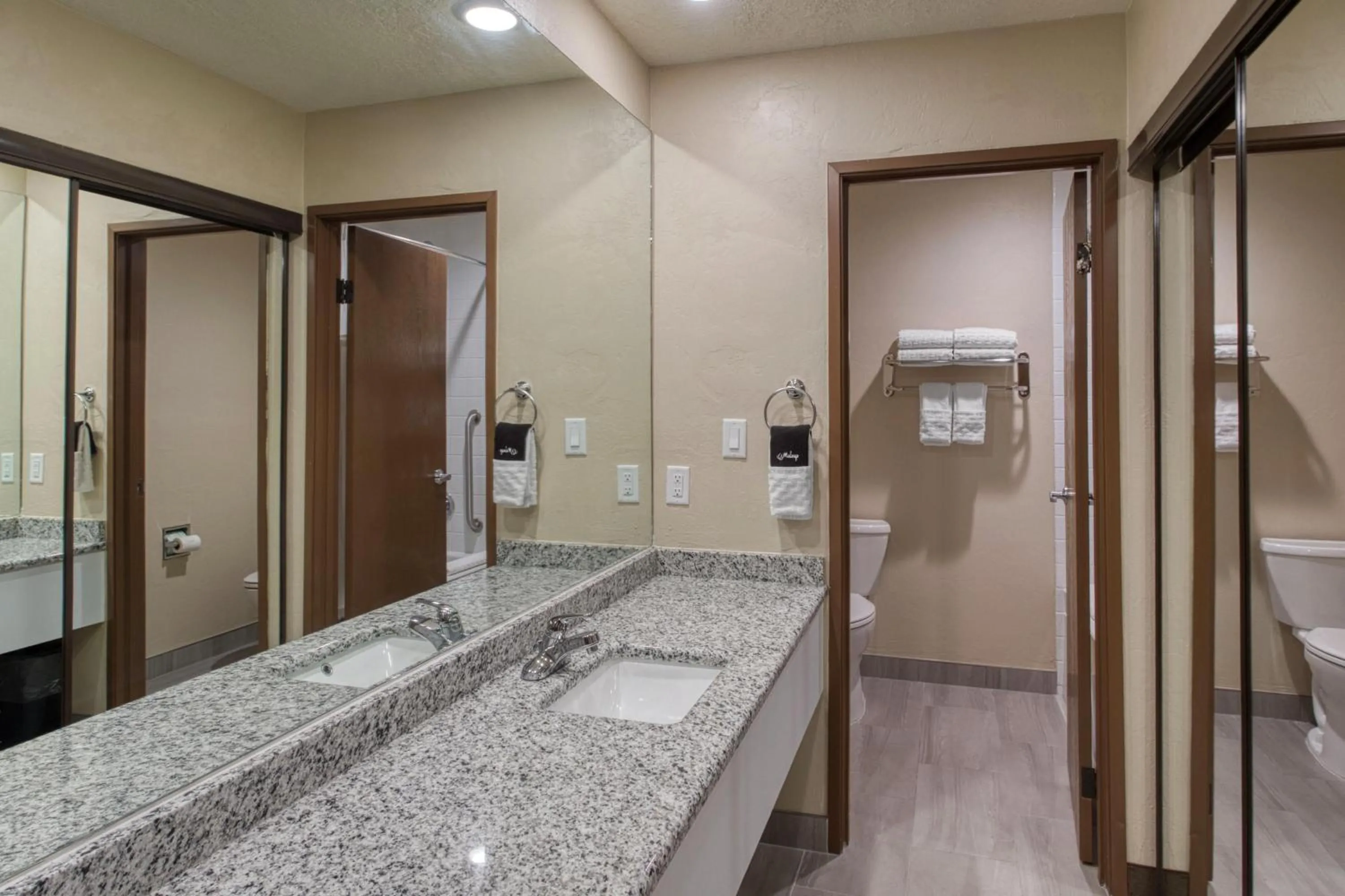 Bathroom in SureStay Plus Hotel by Best Western Price