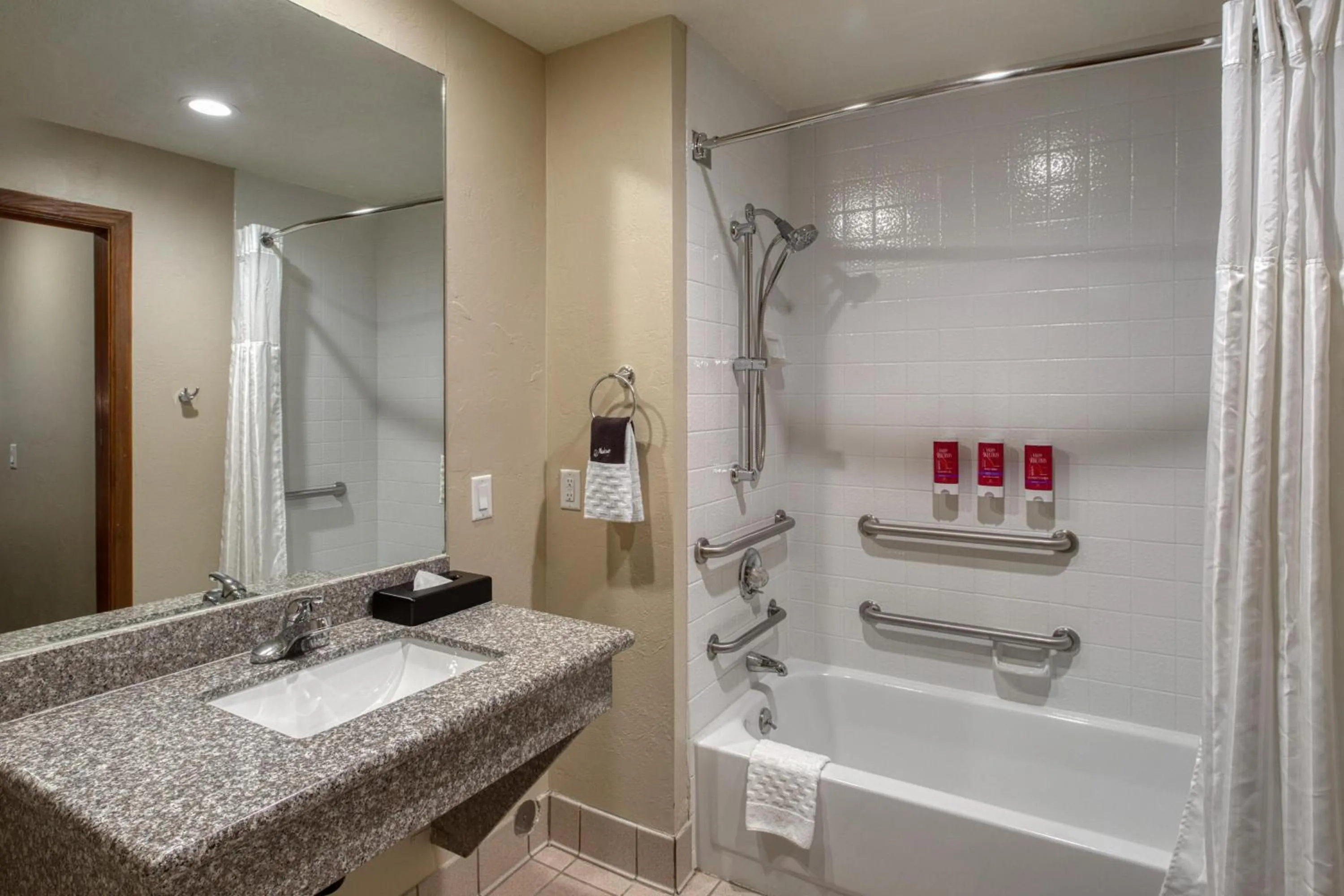 Bathroom in SureStay Plus Hotel by Best Western Price