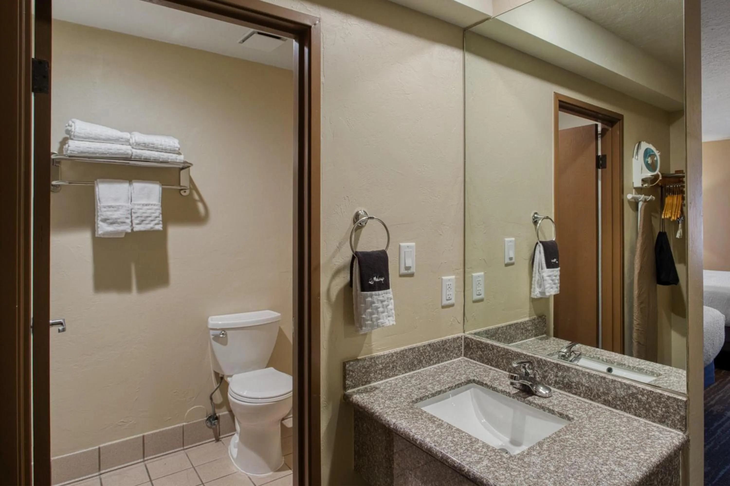 Bathroom in SureStay Plus Hotel by Best Western Price