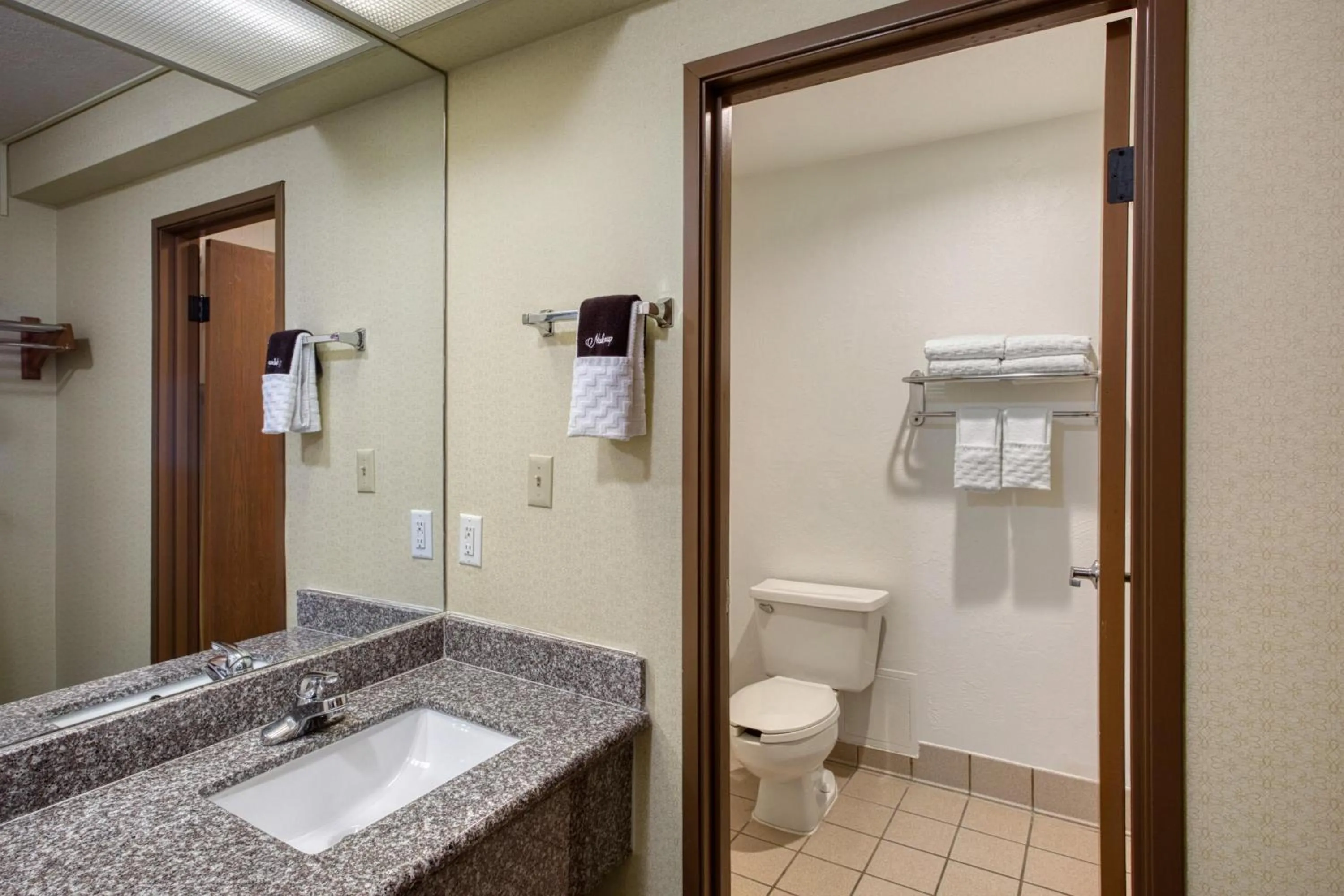 Bathroom in SureStay Plus Hotel by Best Western Price