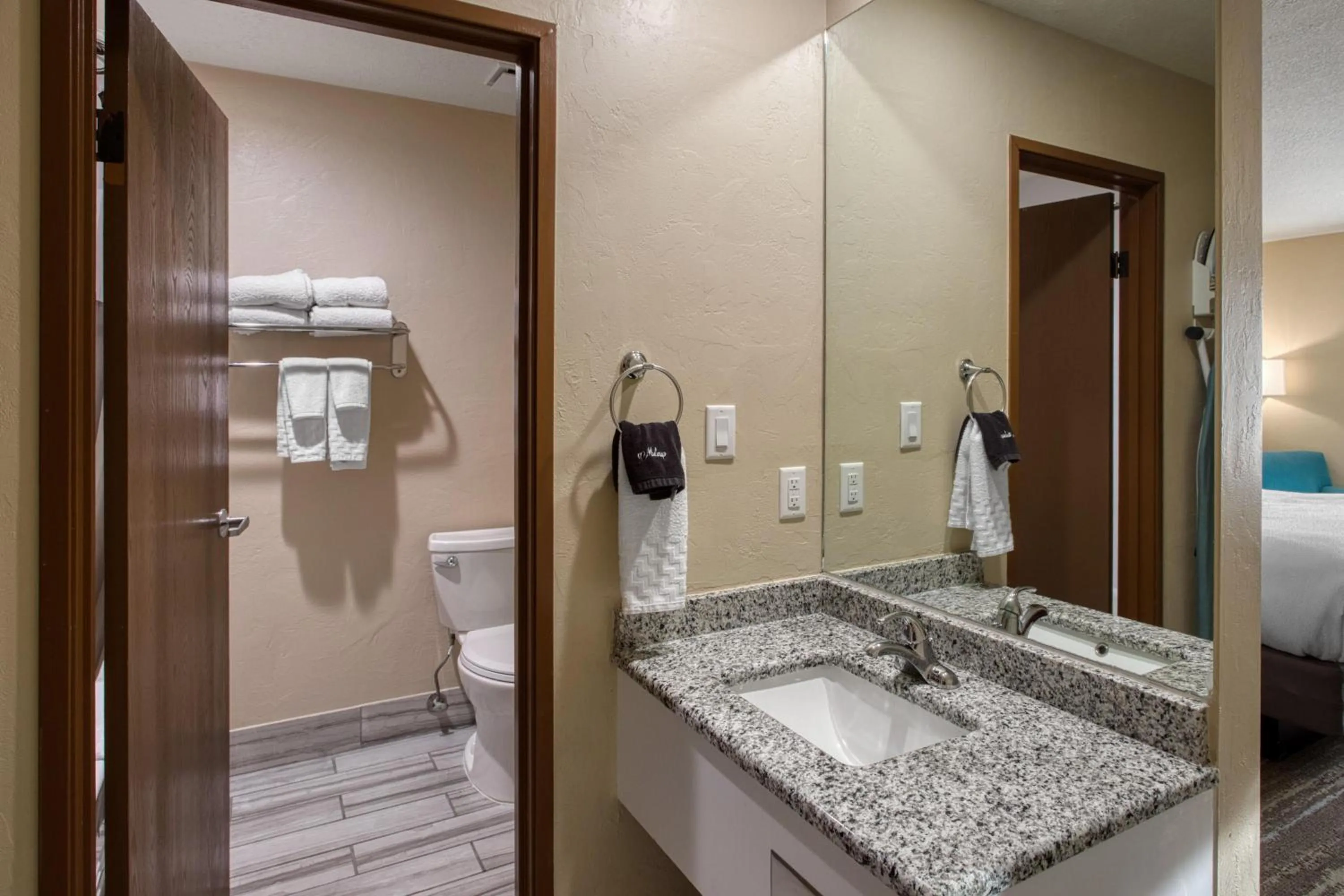 Bathroom in SureStay Plus Hotel by Best Western Price