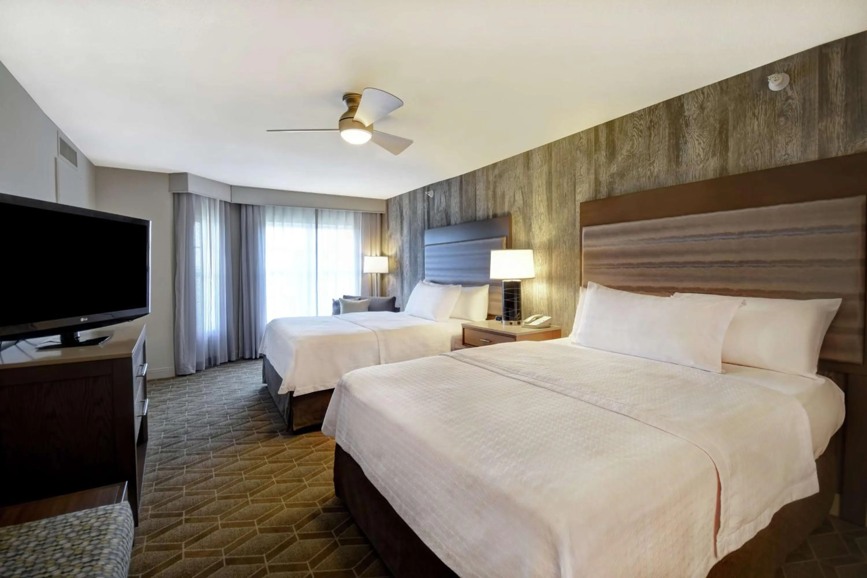 Bed in Homewood Suites by Hilton at The Waterfront