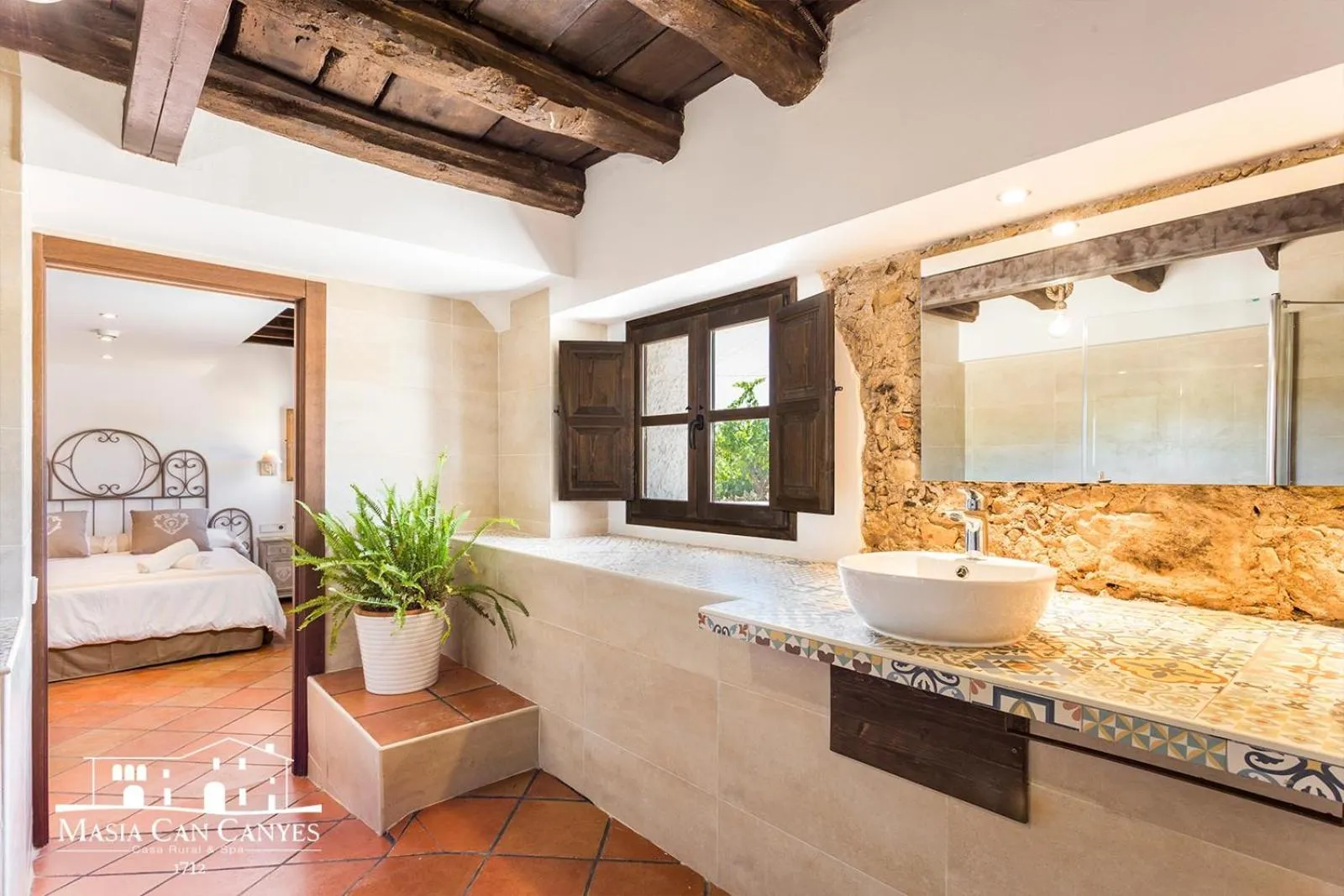 Bathroom in Masia Can Canyes & Spa