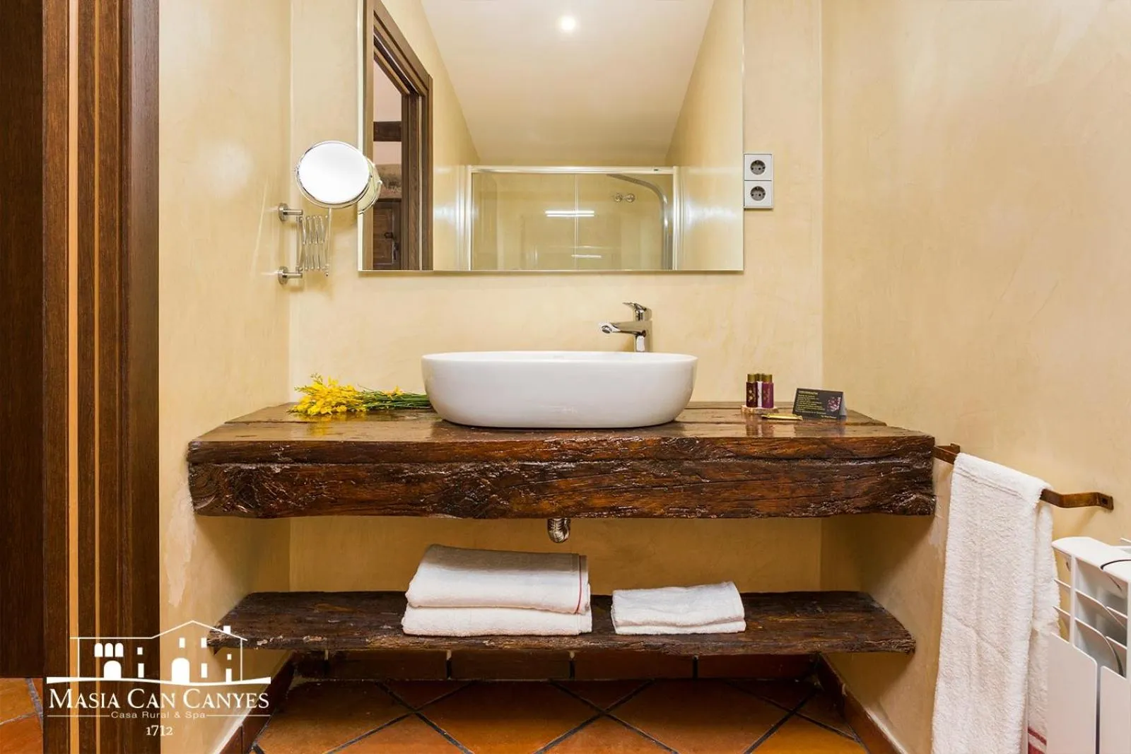Bathroom in Masia Can Canyes & Spa