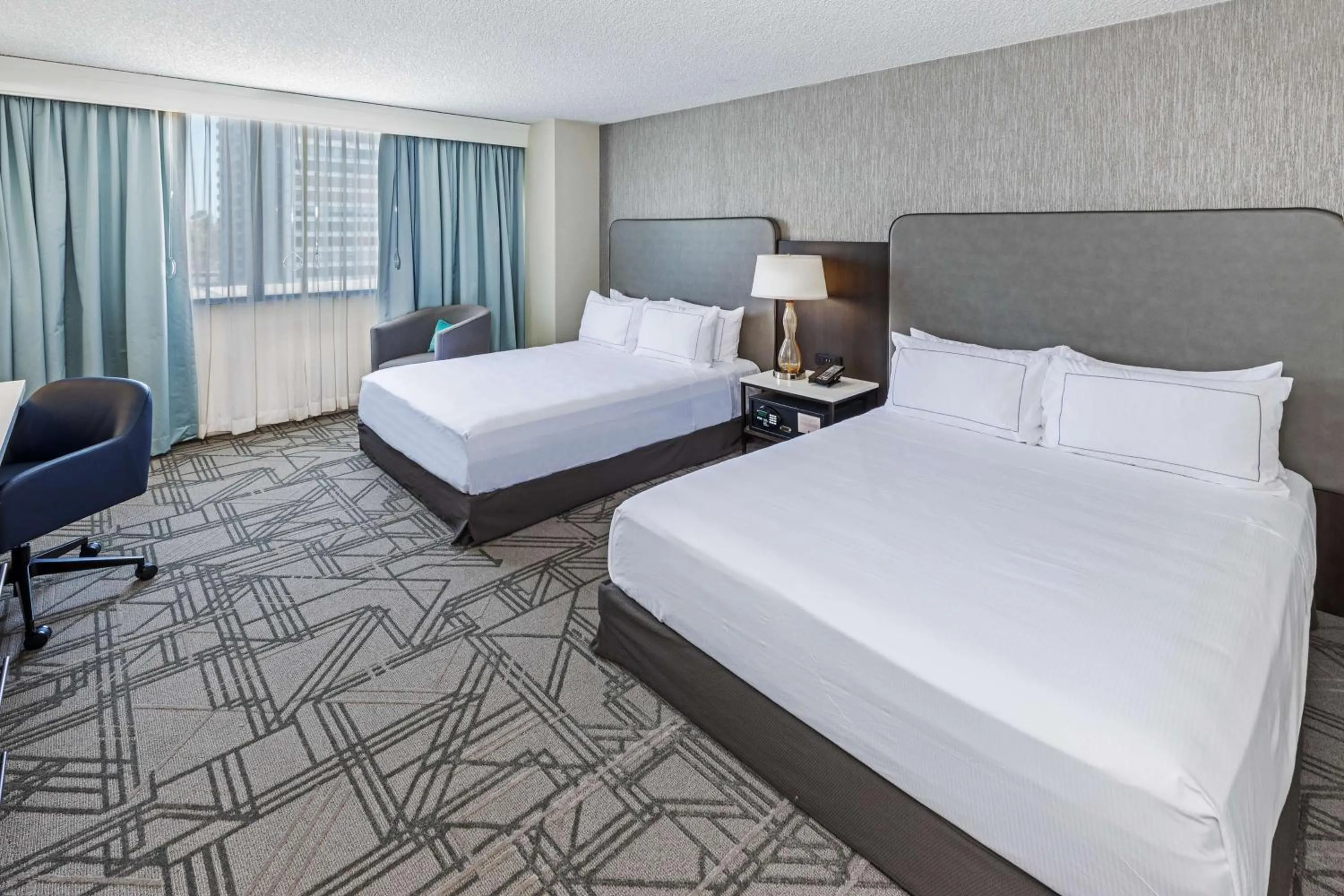 Bed in DoubleTree by Hilton Tulsa Downtown