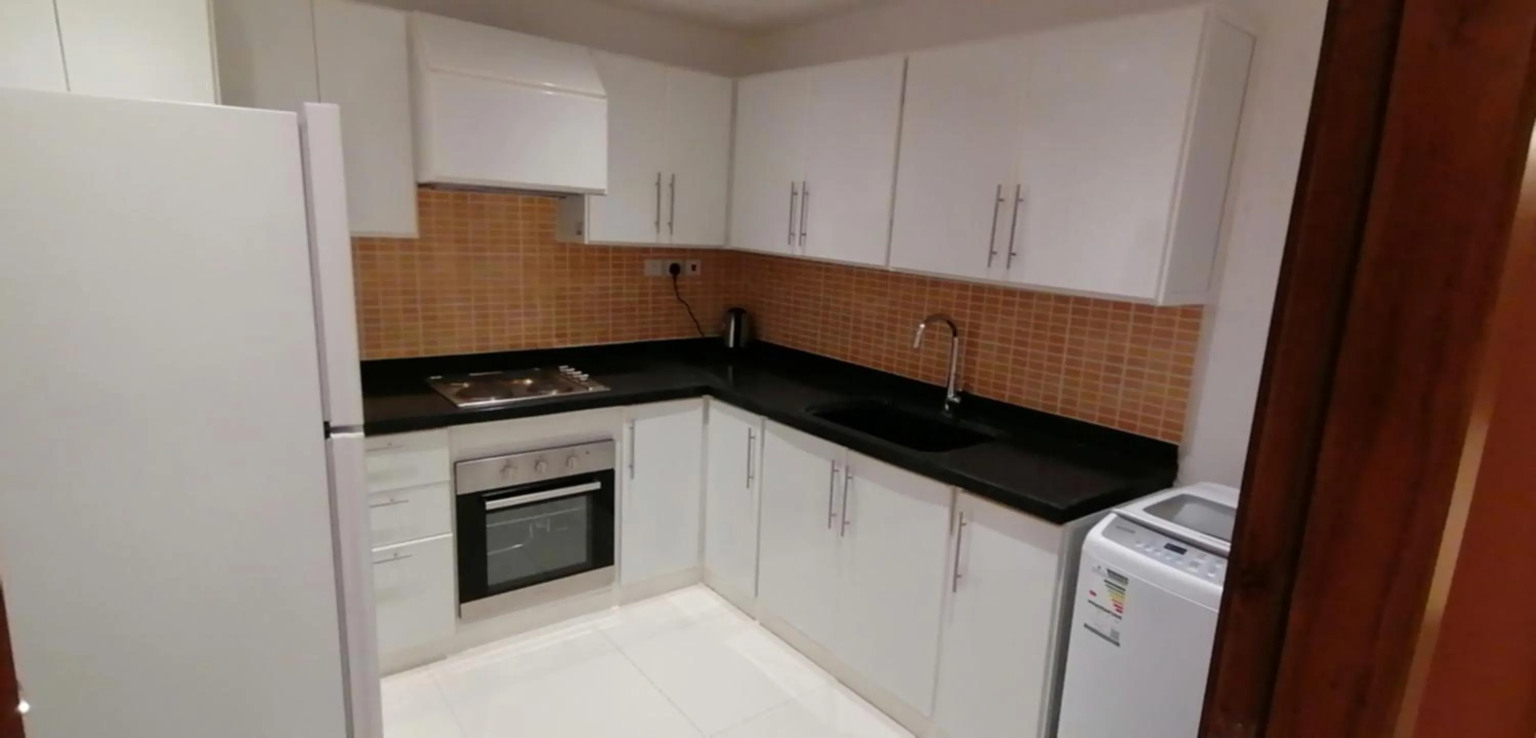 Kitchen or kitchenette in Manazel Al Diafah Serviced Apartments Olaya