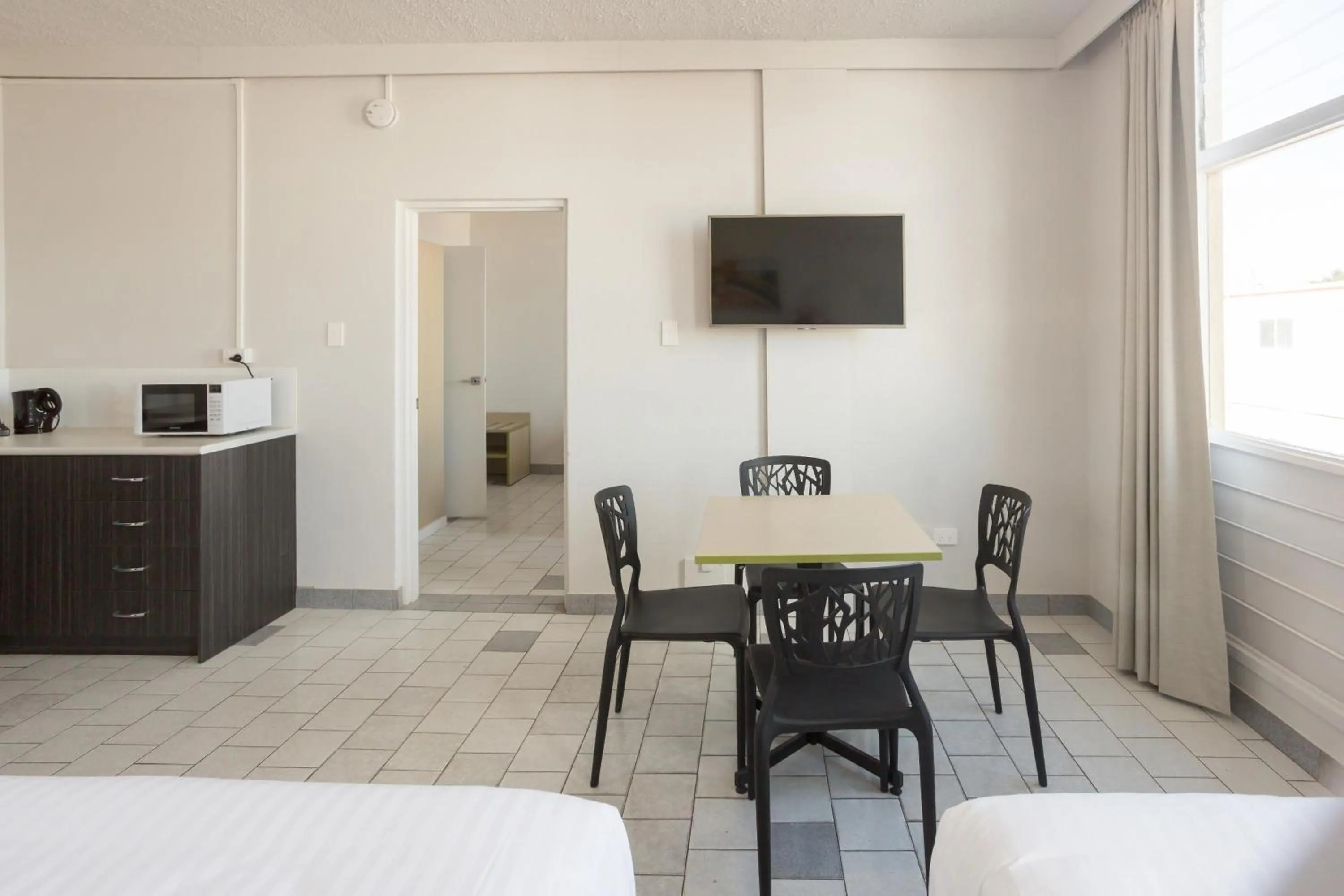 Bedroom, Bed in Nightcap at Emerald Star Hotel