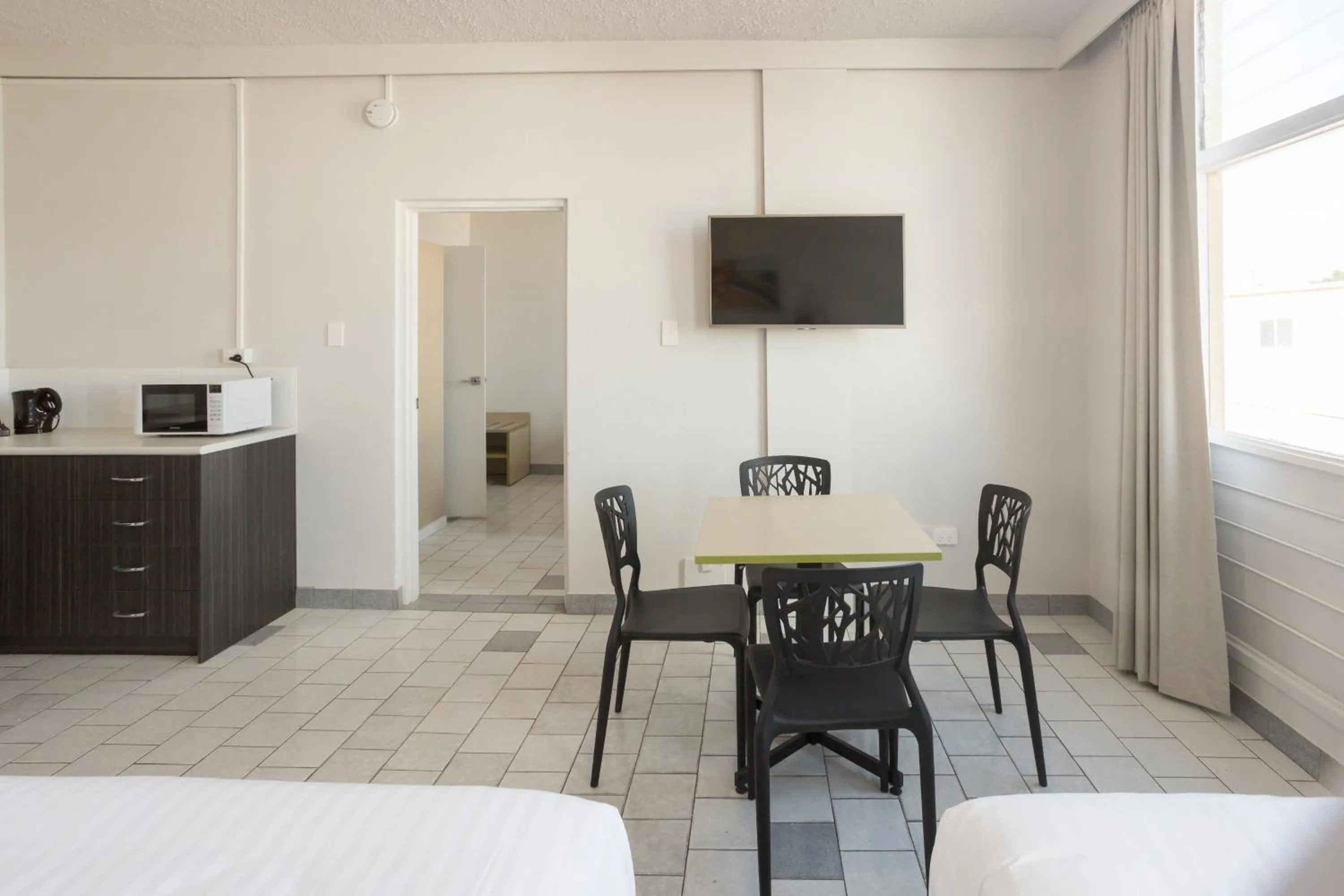 Photo of the whole room, Bed in Nightcap at Emerald Star Hotel