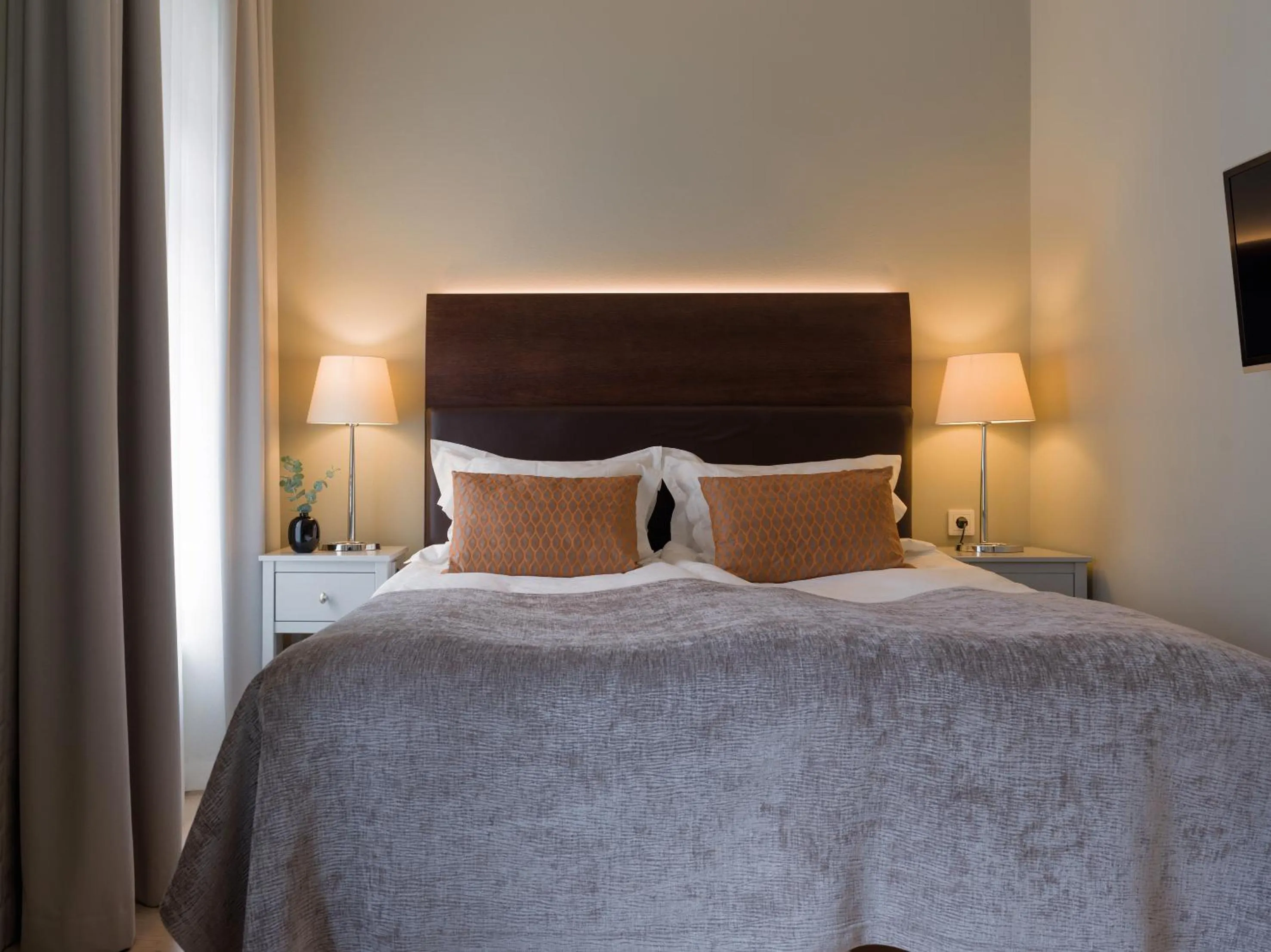 Bed in Elite Hotel Adlon